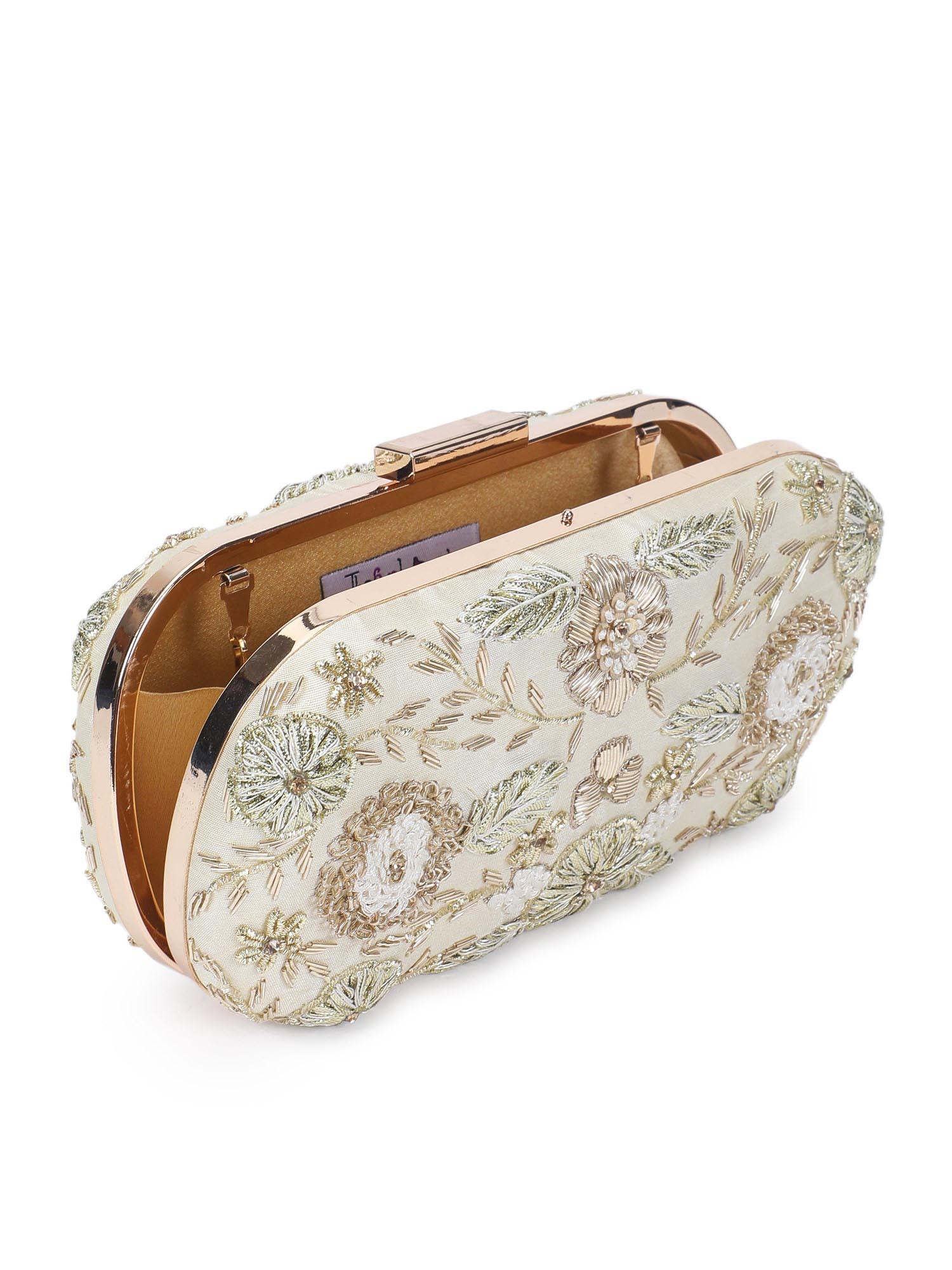 A model showcasing Angelic Gold Clutch by The Purple Sack from The Purple Sack's collection