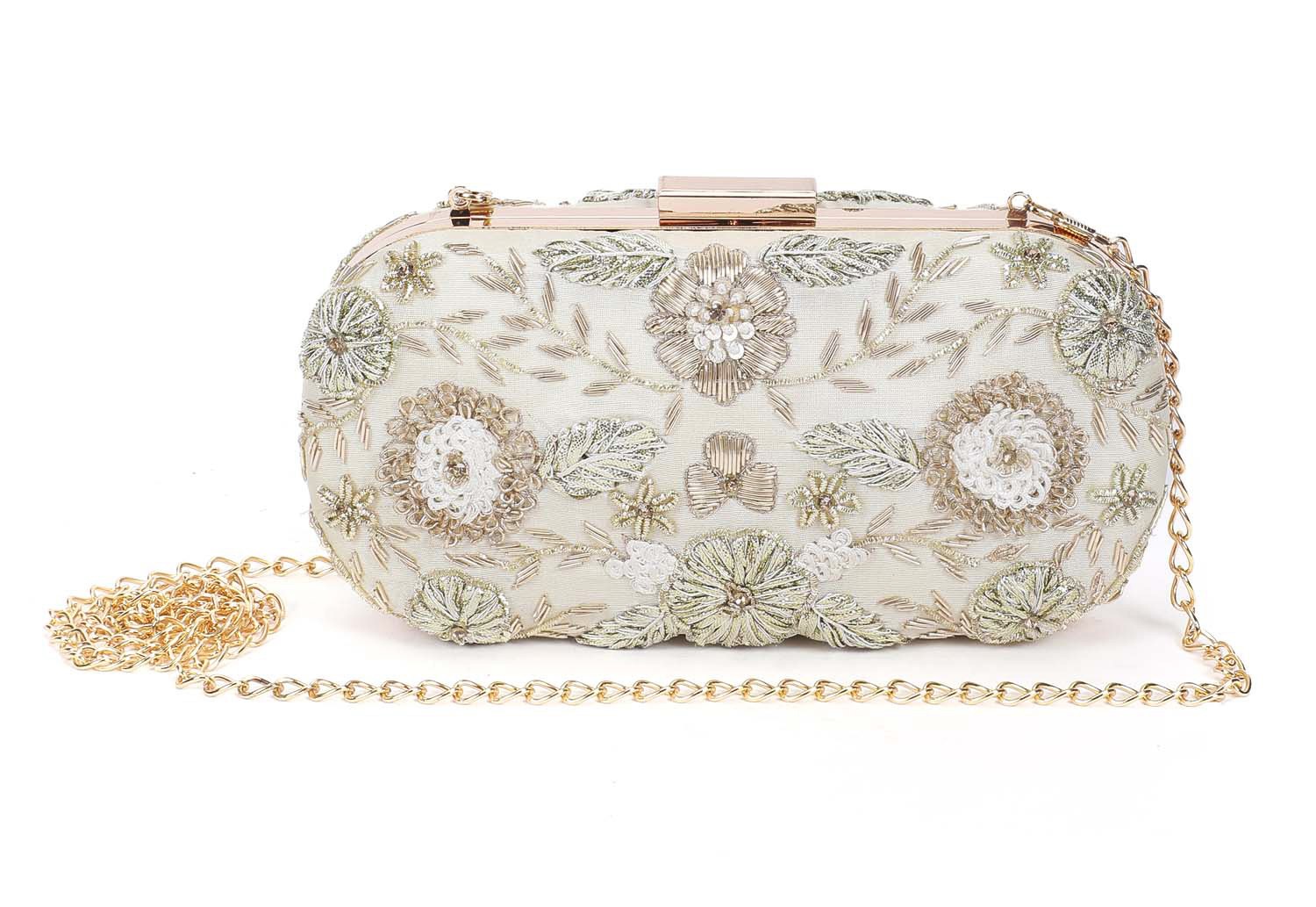 A model showcasing Angelic Gold Clutch by The Purple Sack from The Purple Sack's collection