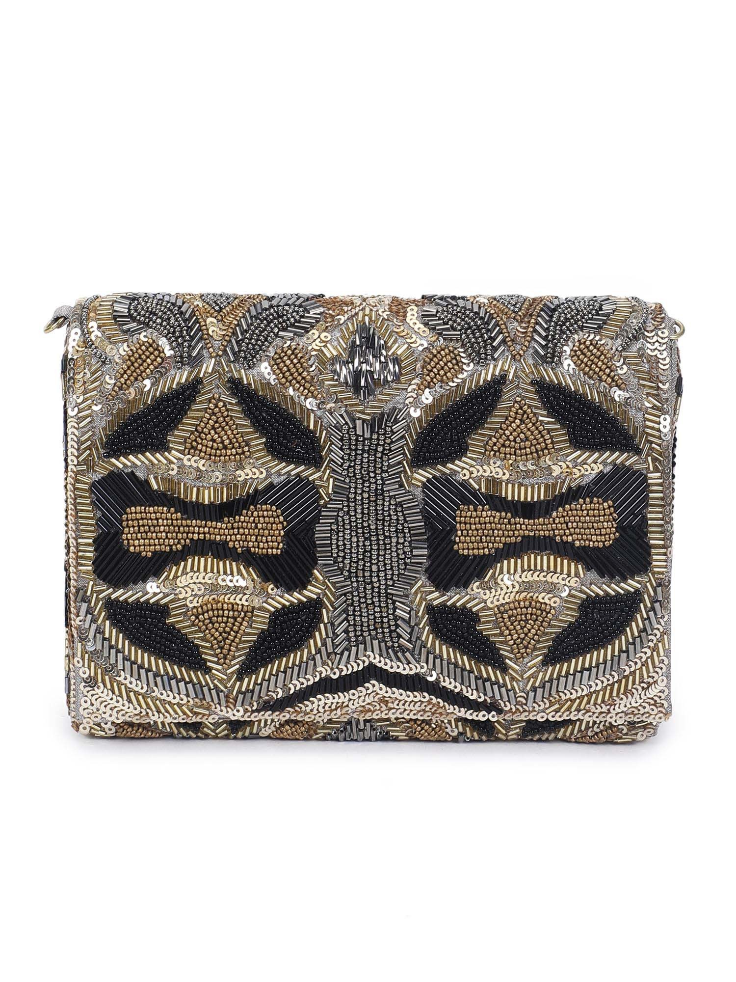 A model showcasing Evergreen Clutch by The Purple Sack from The Purple Sack's collection