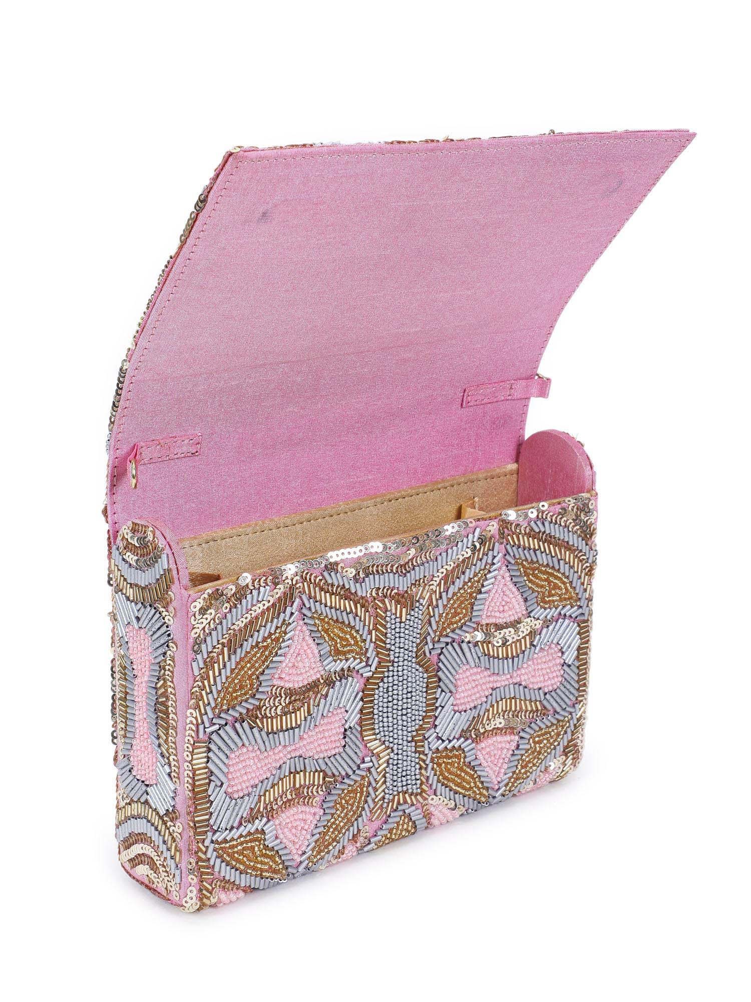 A model showcasing Perfectly Pink Clutch by The Purple Sack from The Purple Sack's collection A model showcasing Perfectly Pink Clutch by The Purple Sack from The Purple Sack's collection
