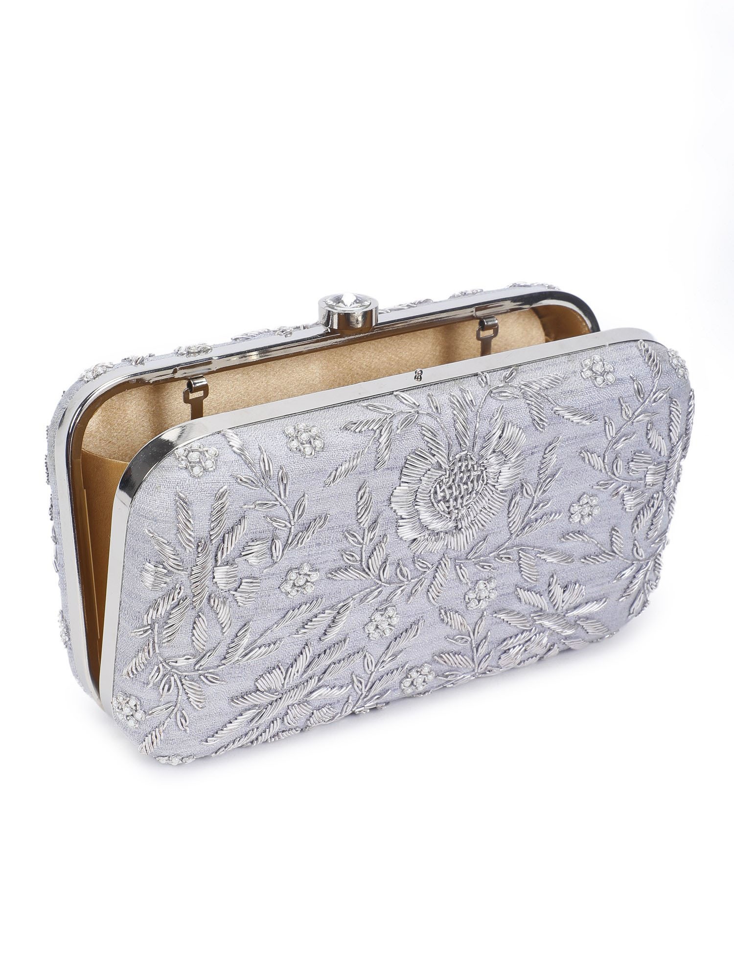 A model showcasing Pleasing Silver Clutch by The Purple Sack from The Purple Sack's collection A model showcasing Pleasing Silver Clutch by The Purple Sack from The Purple Sack's collection