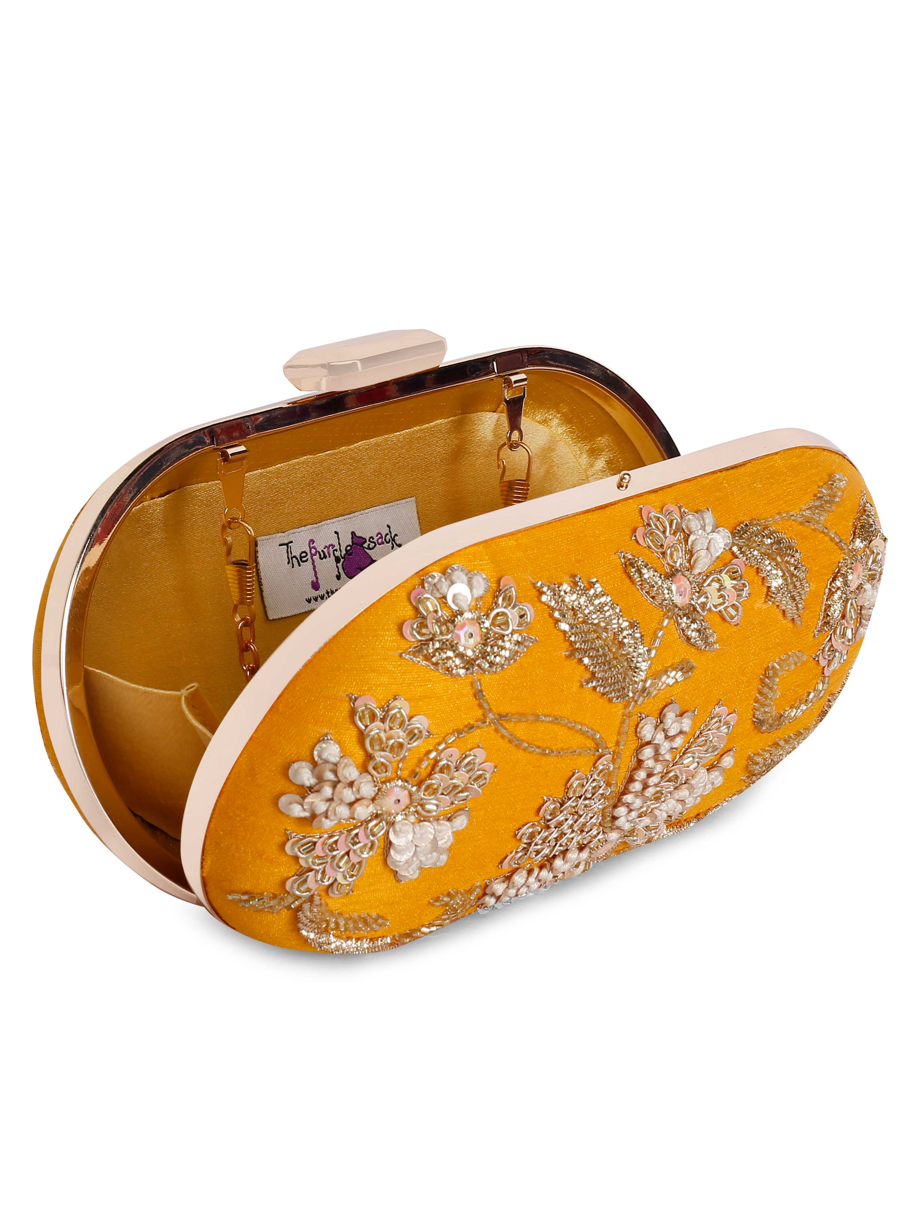 A model showcasing Yellow Sunshine Clutch by The Purple Sack from The Purple Sack's collection