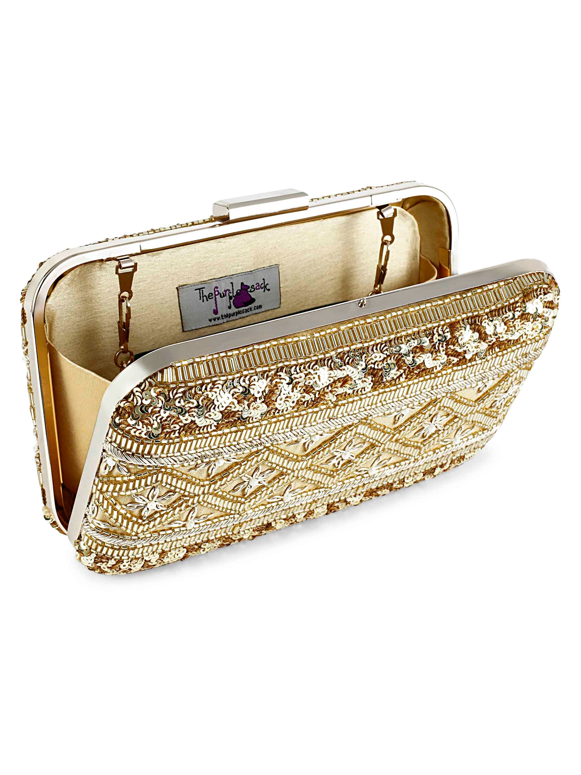 A model showcasing Gold Lined Clutch by The Purple Sack from The Purple Sack's collection A model showcasing Gold Lined Clutch by The Purple Sack from The Purple Sack's collection