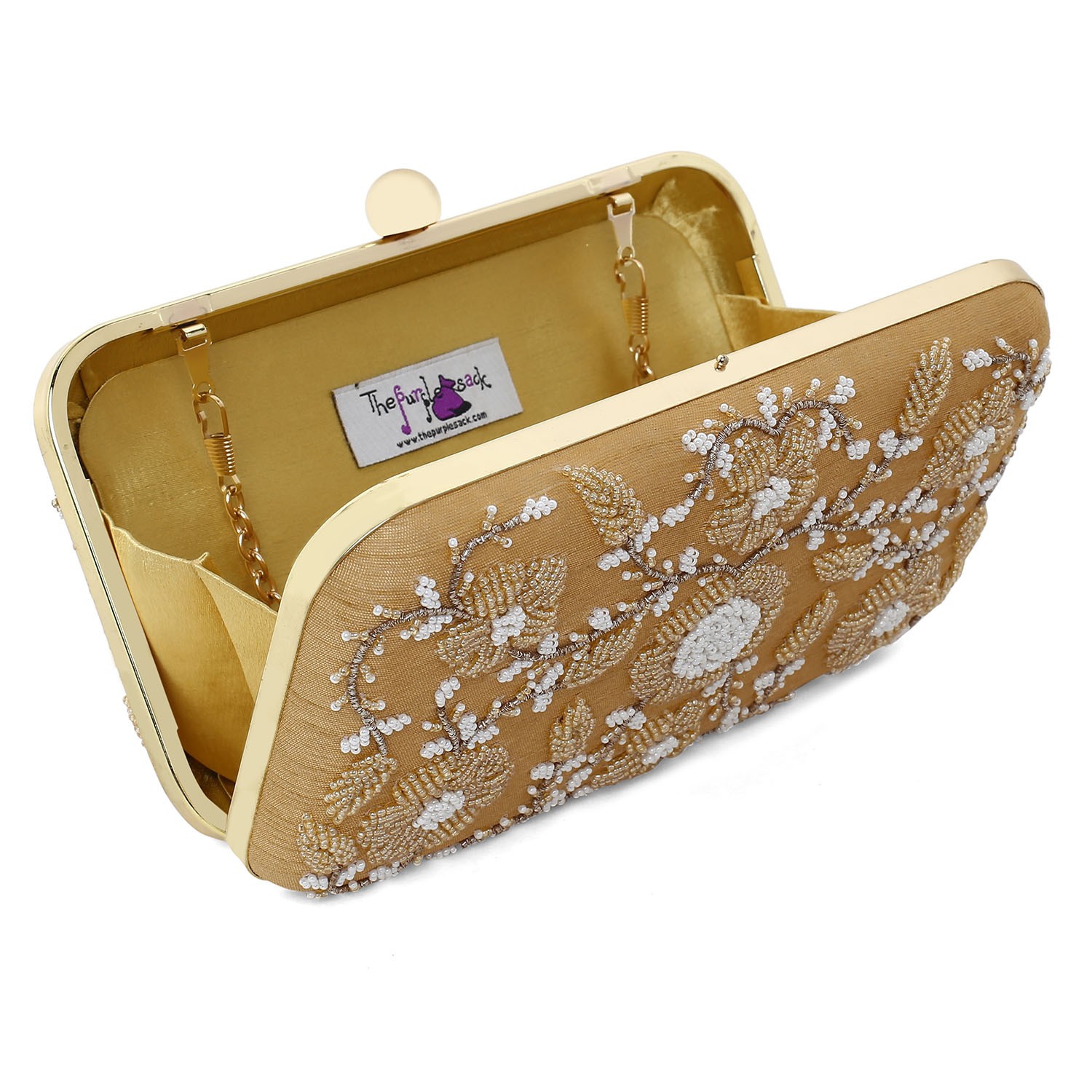 A model showcasing Golden Elegant Clutch by The Purple Sack from The Purple Sack's collection