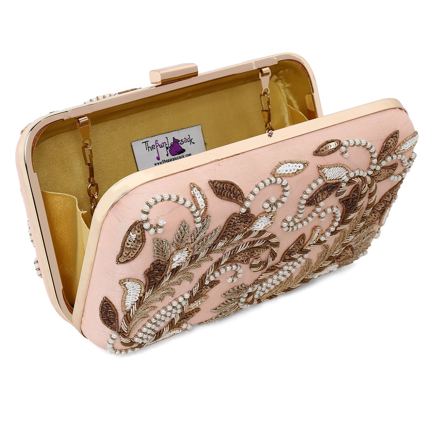 A model showcasing Peach Double Paisley Clutch by The Purple Sack from The Purple Sack's collection A model showcasing Peach Double Paisley Clutch by The Purple Sack from The Purple Sack's collection