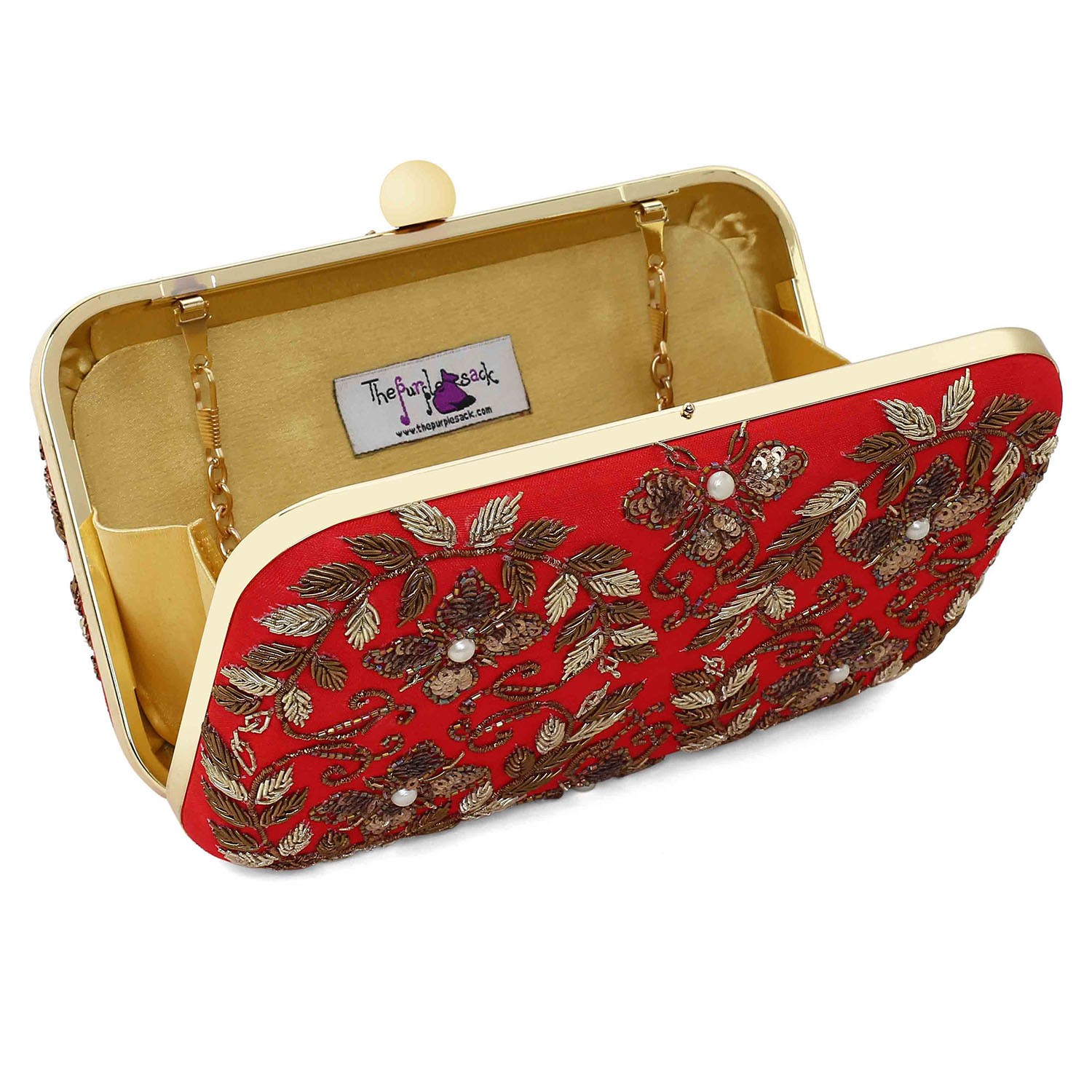 A model showcasing Red Rani Clutch by The Purple Sack from The Purple Sack's collection A model showcasing Red Rani Clutch by The Purple Sack from The Purple Sack's collection