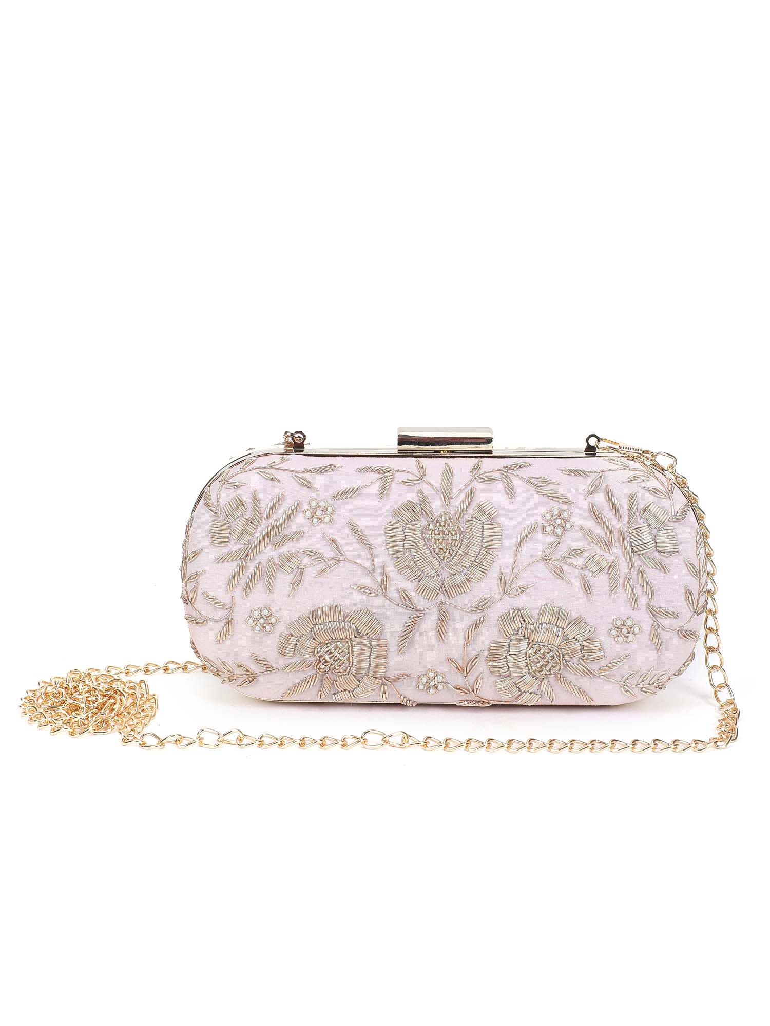 A model showcasing Pretty Pink Floral Clutch by The Purple Sack from The Purple Sack's collection A model showcasing Pretty Pink Floral Clutch by The Purple Sack from The Purple Sack's collection
