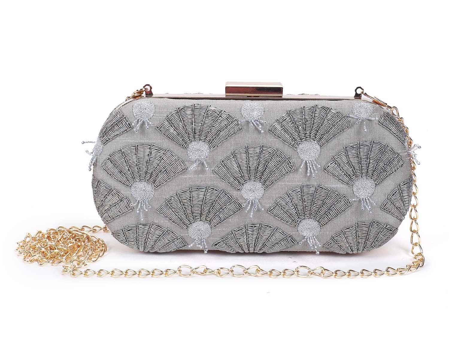 A model showcasing Grey Fan Clutch by The Purple Sack from The Purple Sack's collection A model showcasing Grey Fan Clutch by The Purple Sack from The Purple Sack's collection