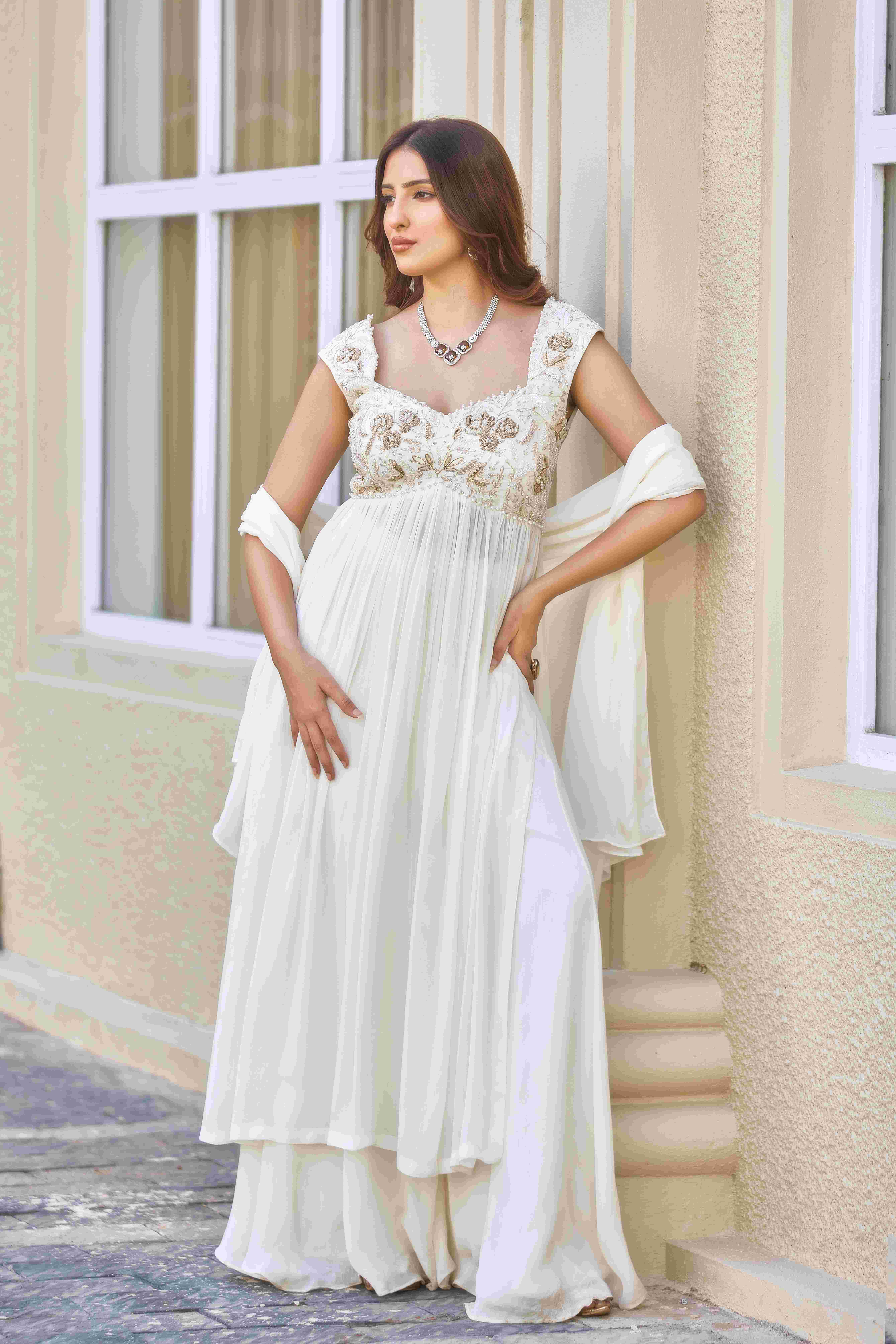 A model showcasing The Unspoken Yes Sharara Suit by D And V from D And V's collection