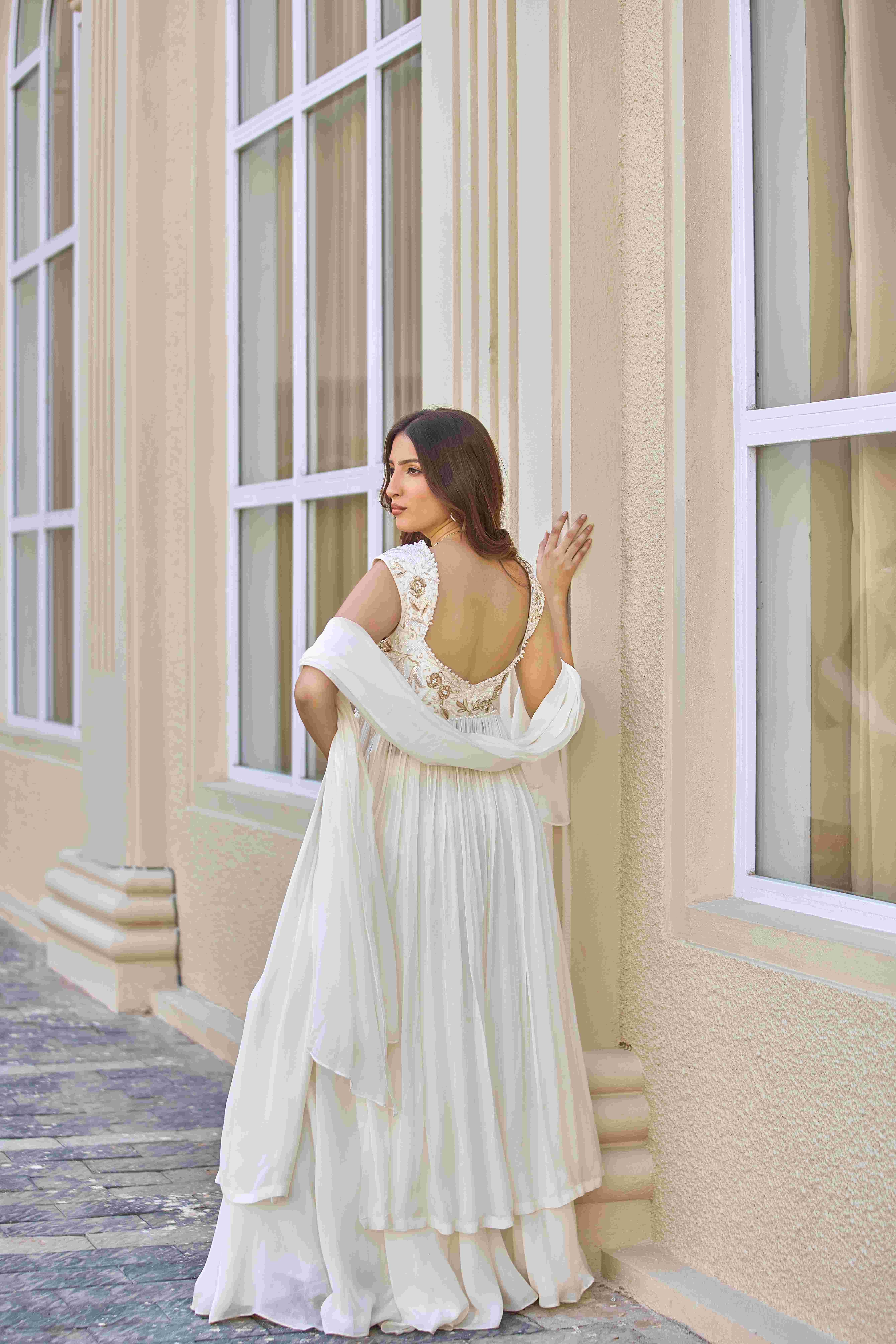 A model showcasing The Unspoken Yes Sharara Suit by D And V from D And V's collection