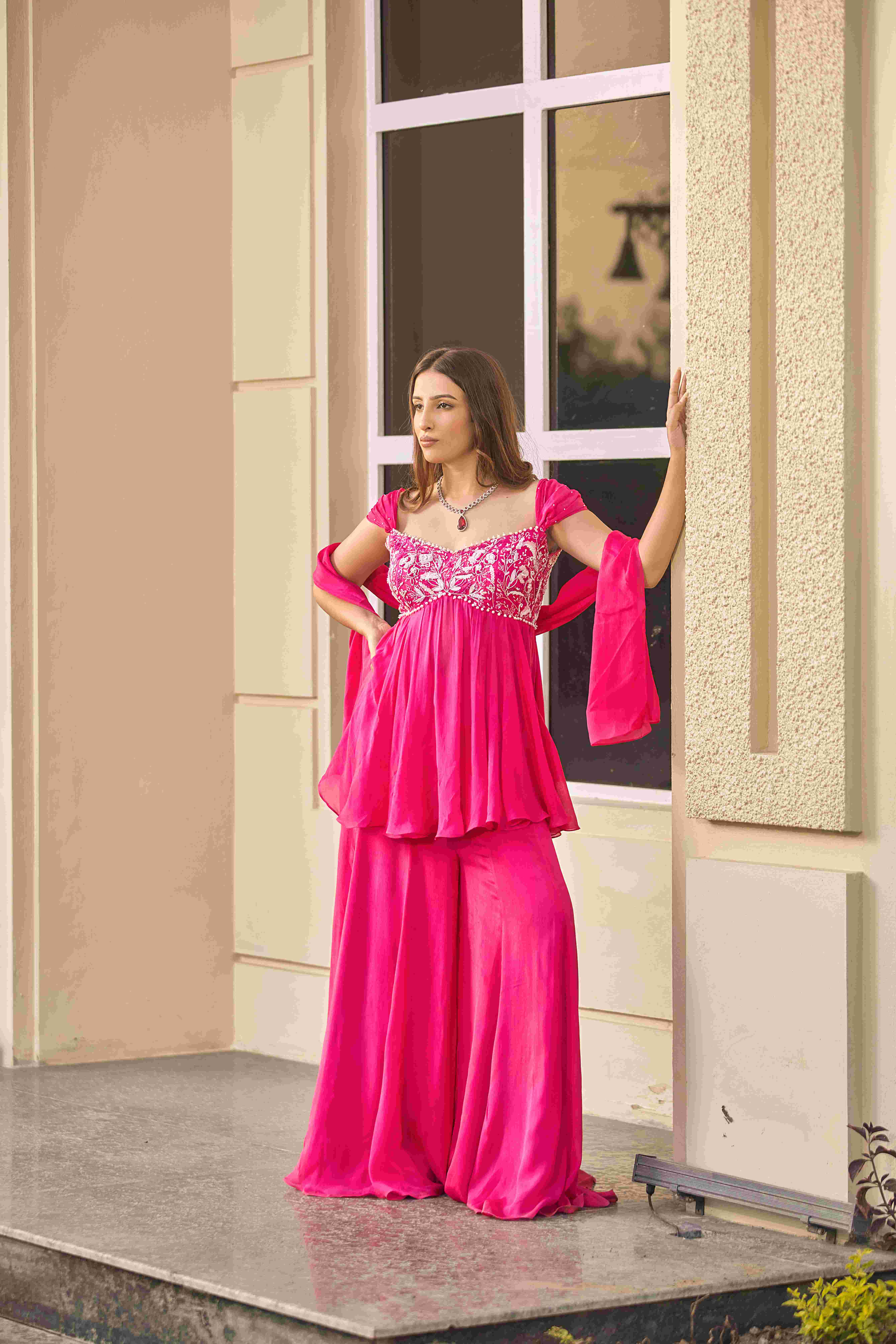 A model showcasing Breathless Sharara Set by D And V from D And V's collection