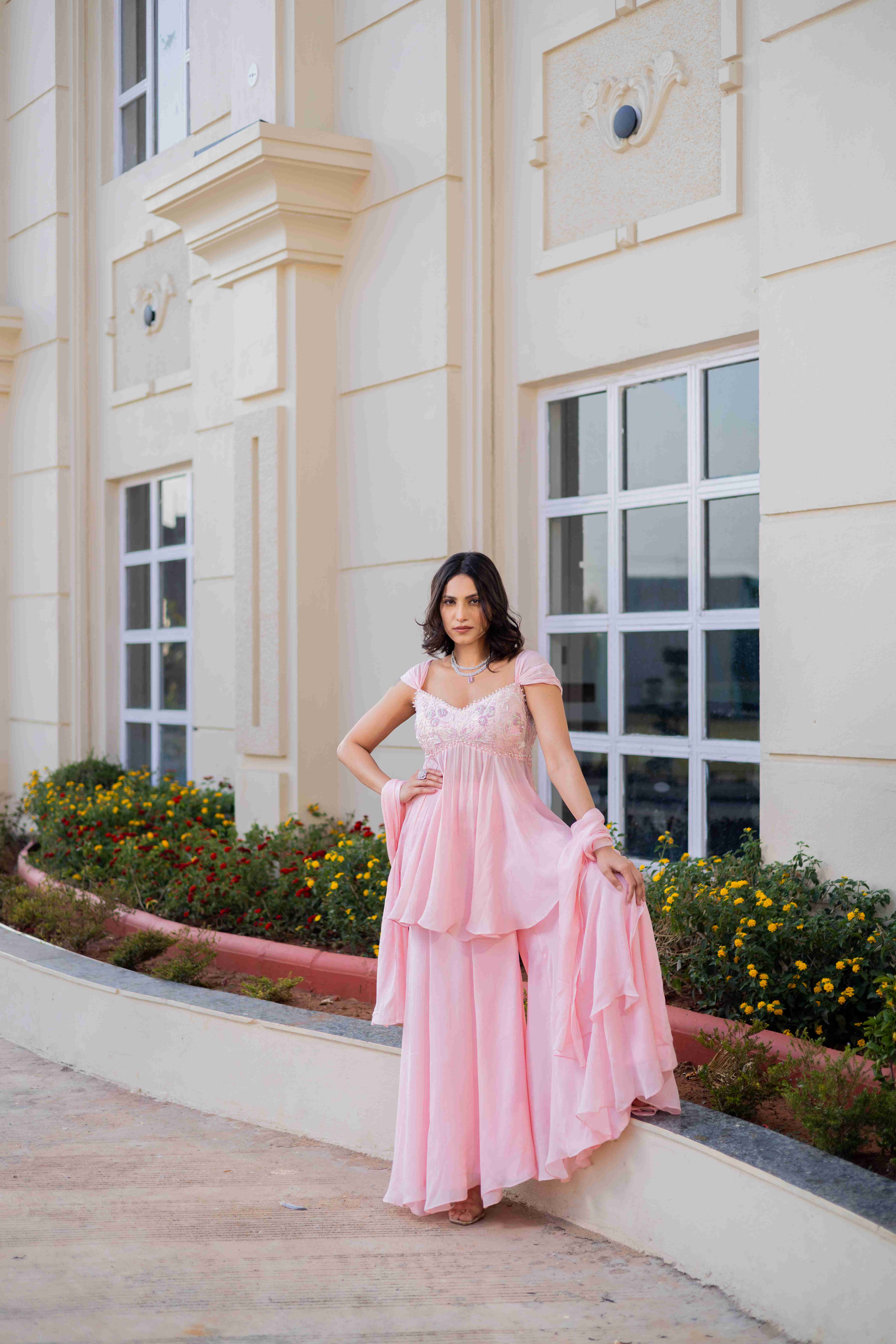 A model showcasing Almost A Dream Sharara Suit by D And V from D And V's collection