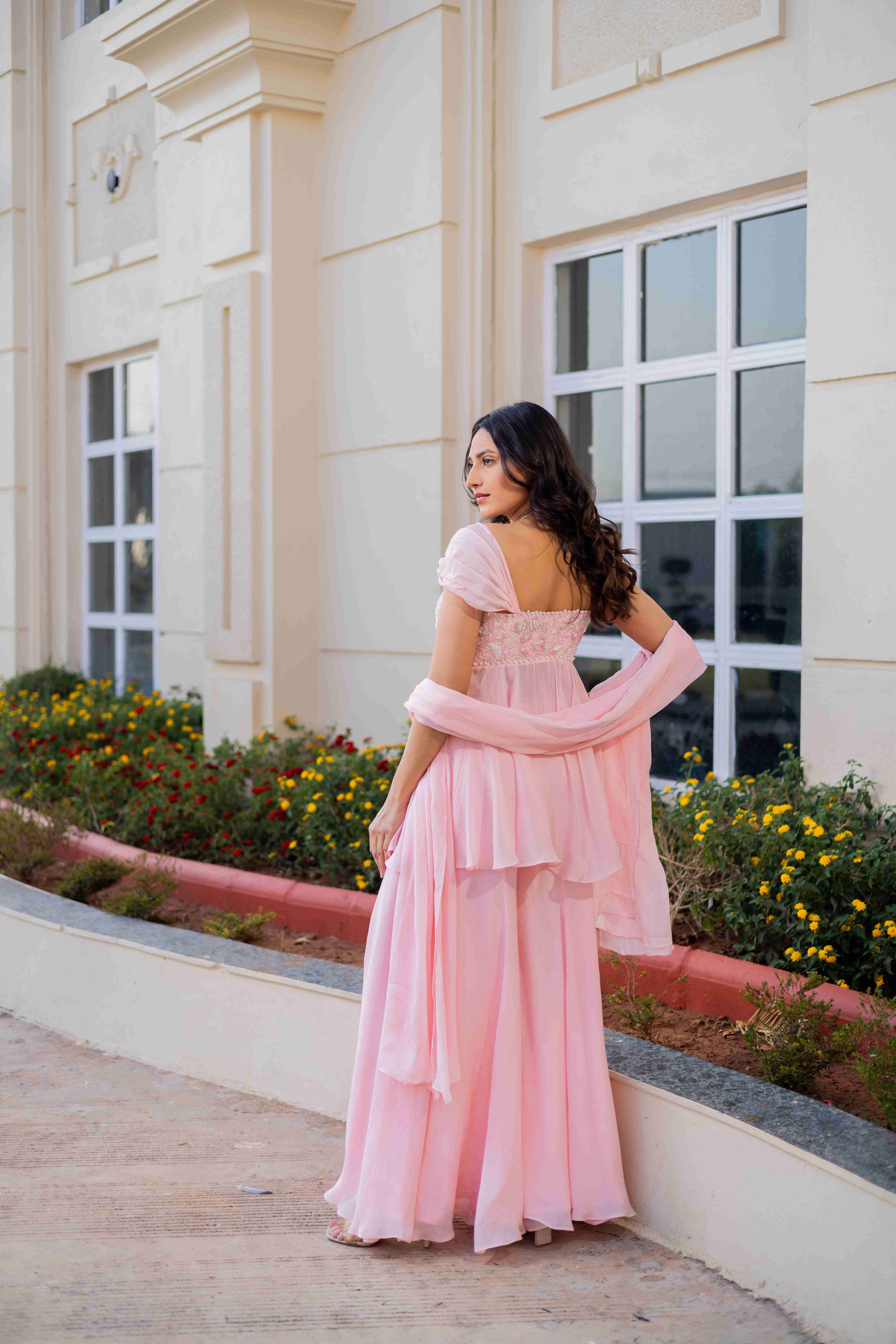 A model showcasing Almost A Dream Sharara Suit by D And V from D And V's collection