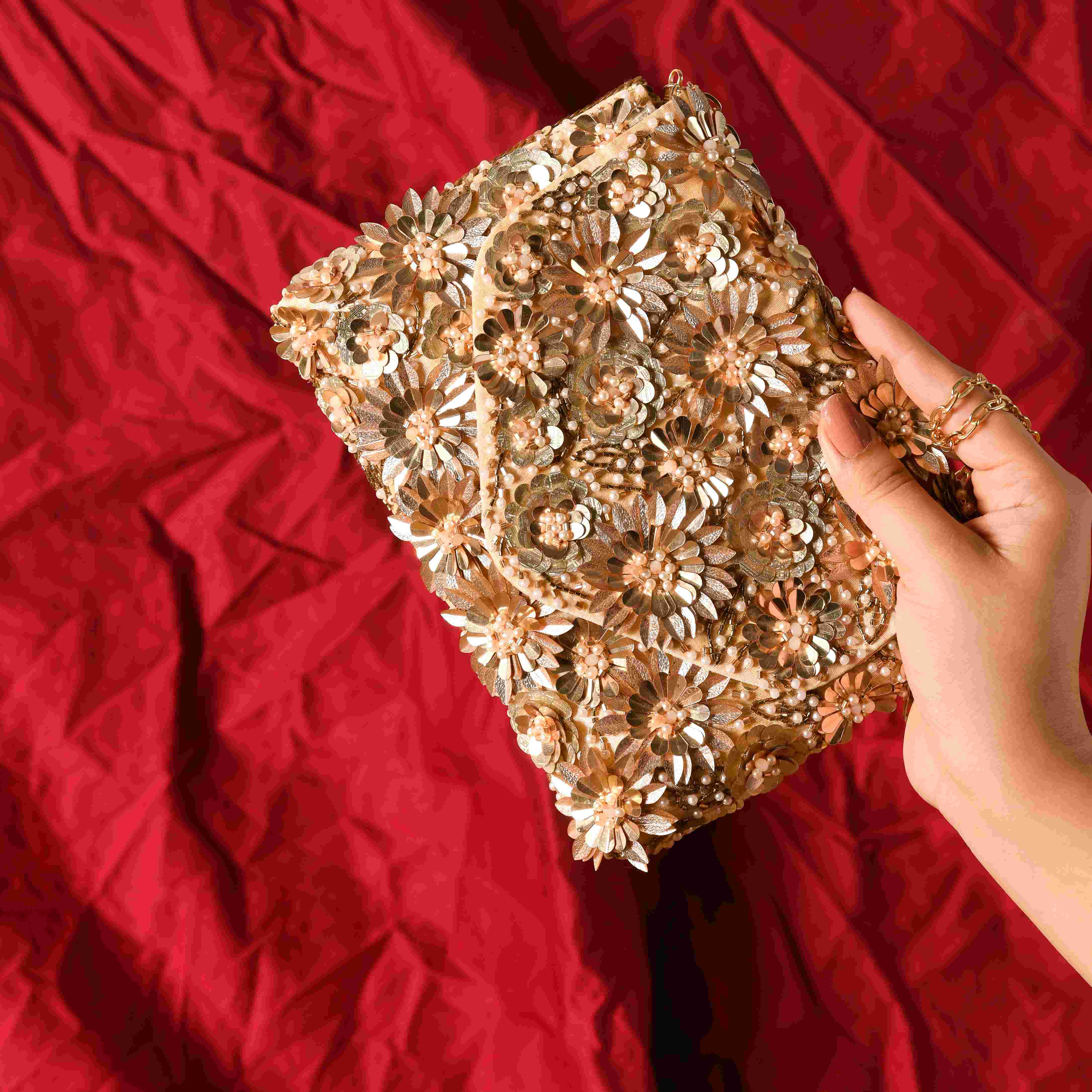 A model showcasing Blaze Sequin Clutch by The Purple Sack from The Purple Sack's collection