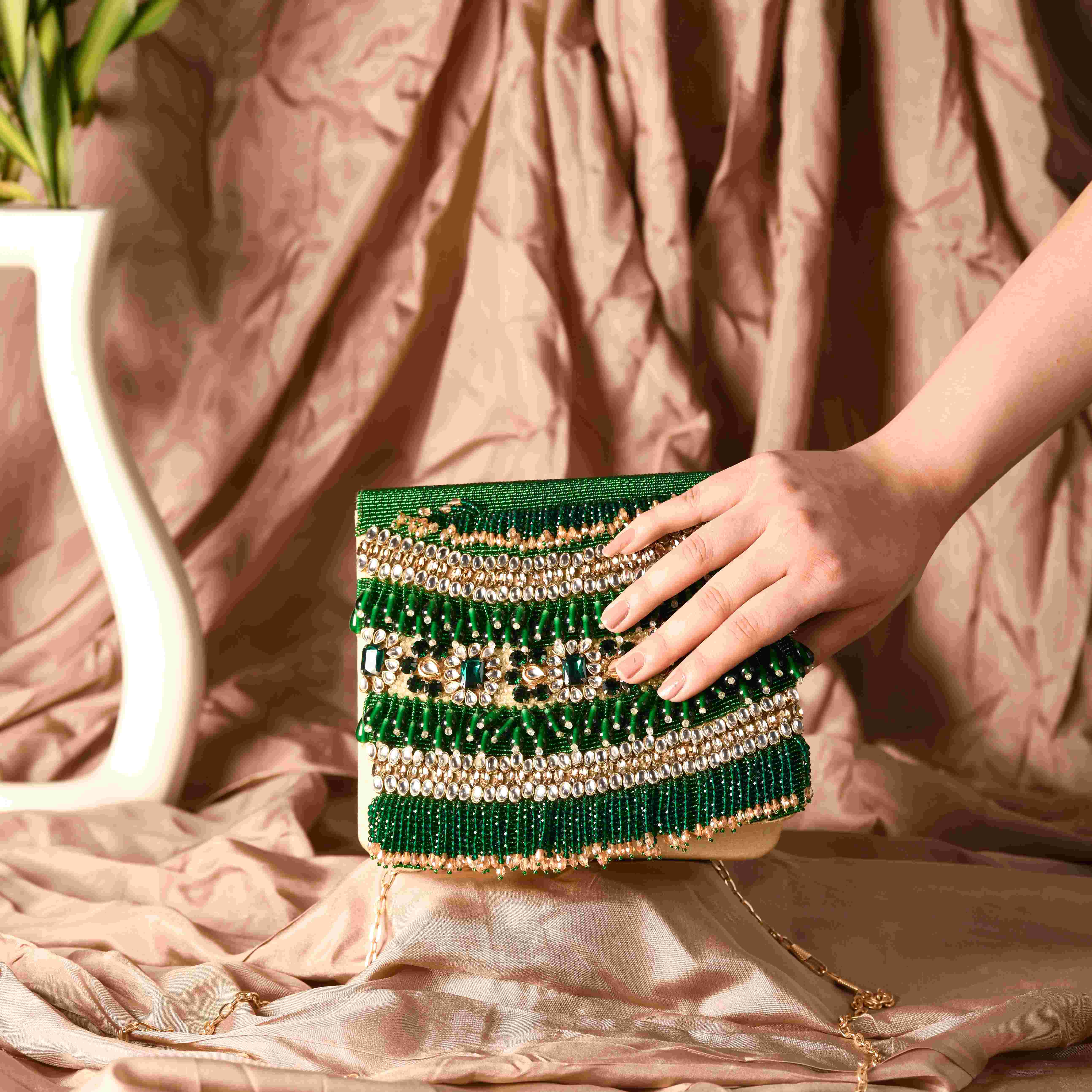 A model showcasing Sukoon Clutch by The Purple Sack from The Purple Sack's collection A model showcasing Sukoon Clutch by The Purple Sack from The Purple Sack's collection