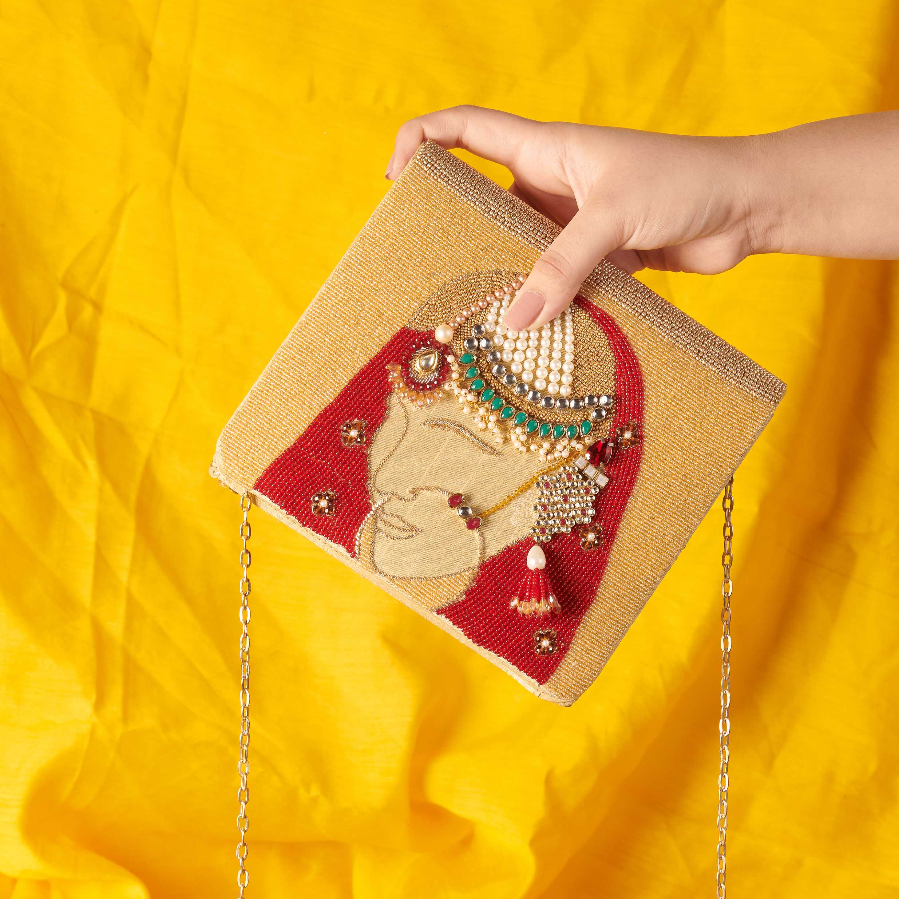 A model showcasing Dulhan Clutch by The Purple Sack from The Purple Sack's collection A model showcasing Dulhan Clutch by The Purple Sack from The Purple Sack's collection