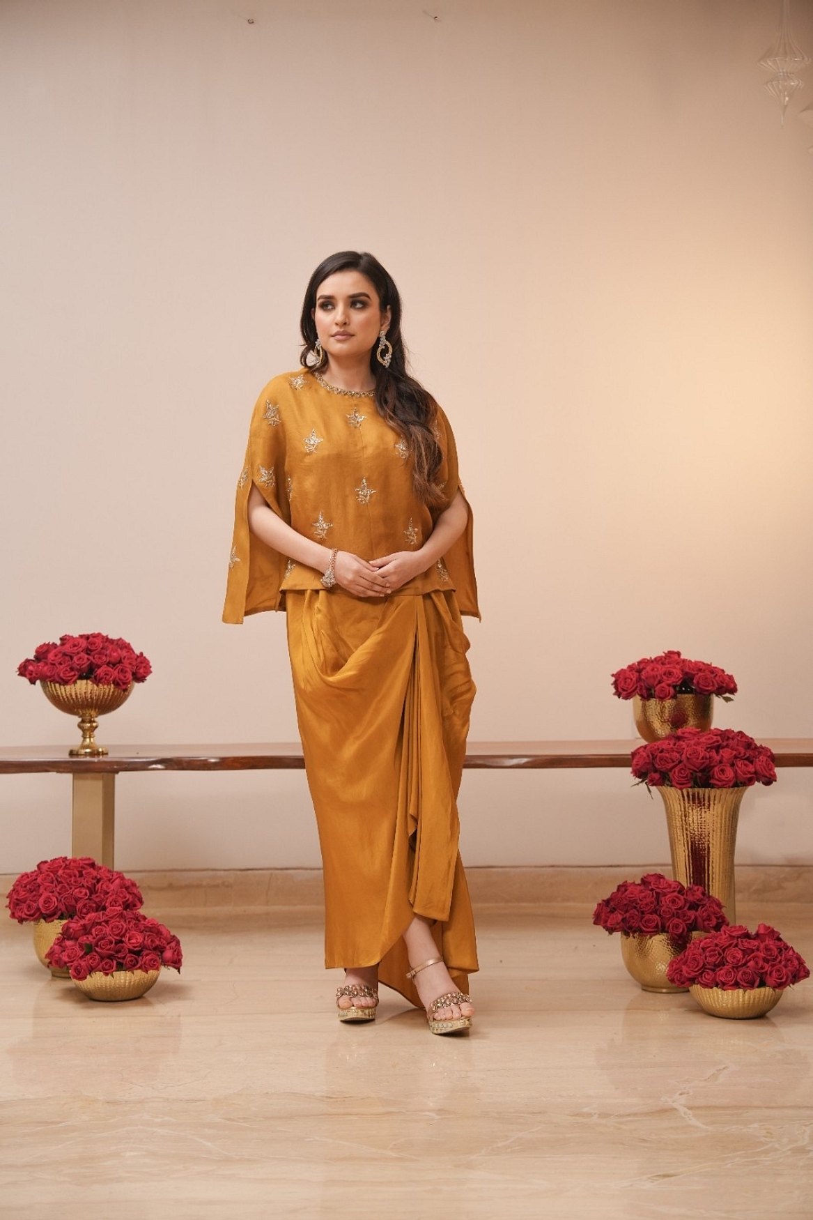 A model showcasing Mustard Cape And Dhoti Set Feature image by Myra By Anju Narian from Myra By Anju Narian's collection