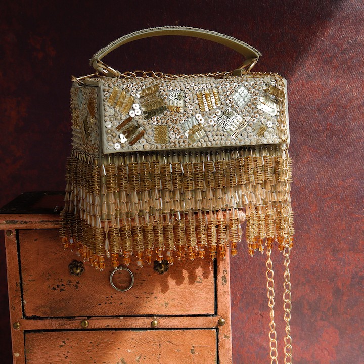 A model showcasing Rizuana Clutch Feature image by The Purple Sack from The Purple Sack's collection