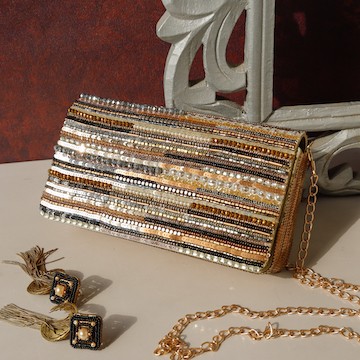 A model showcasing Narmadaa Clutch Feature image by The Purple Sack from The Purple Sack's collection