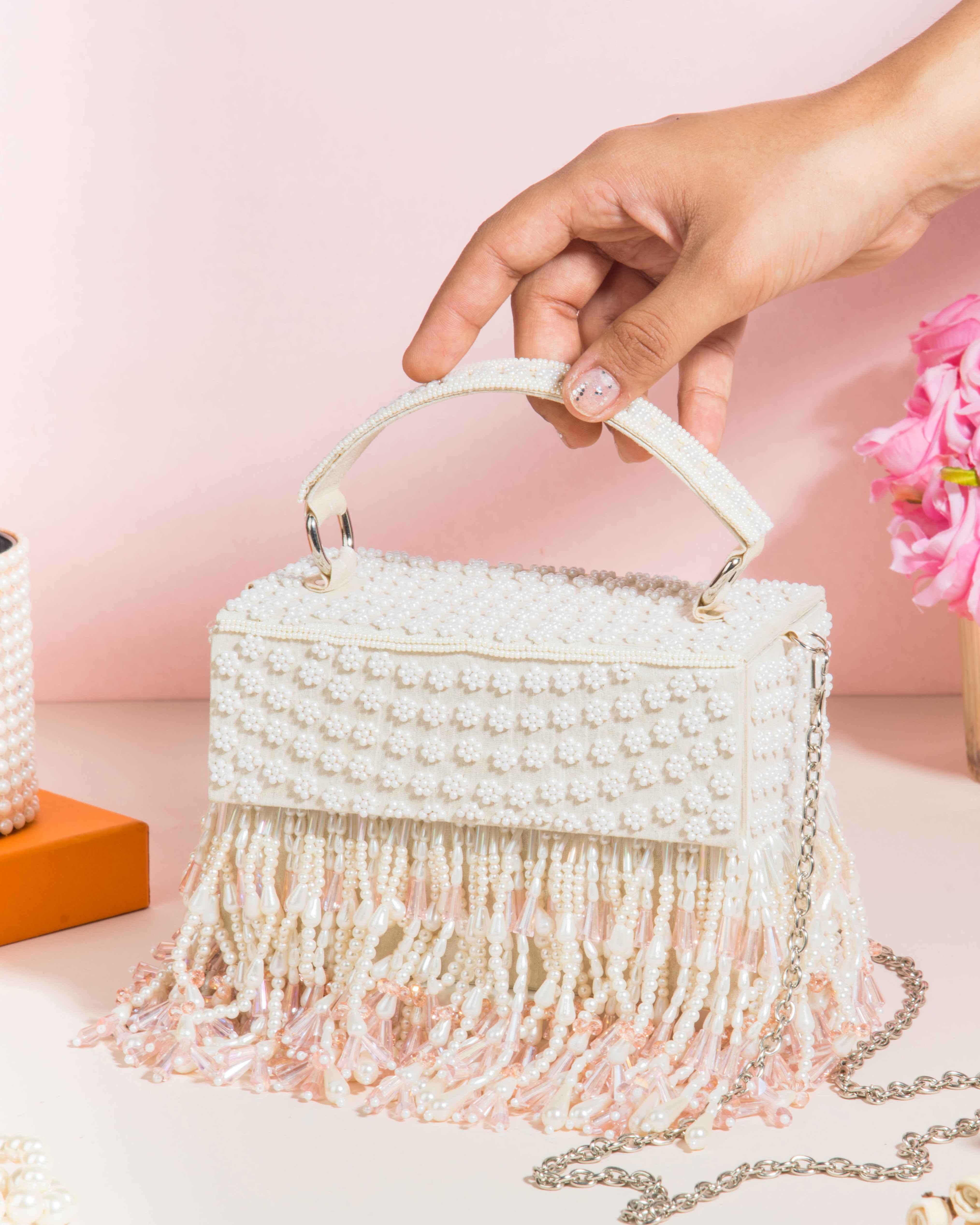A model showcasing Roshiyaan Clutch by The Purple Sack from The Purple Sack's collection