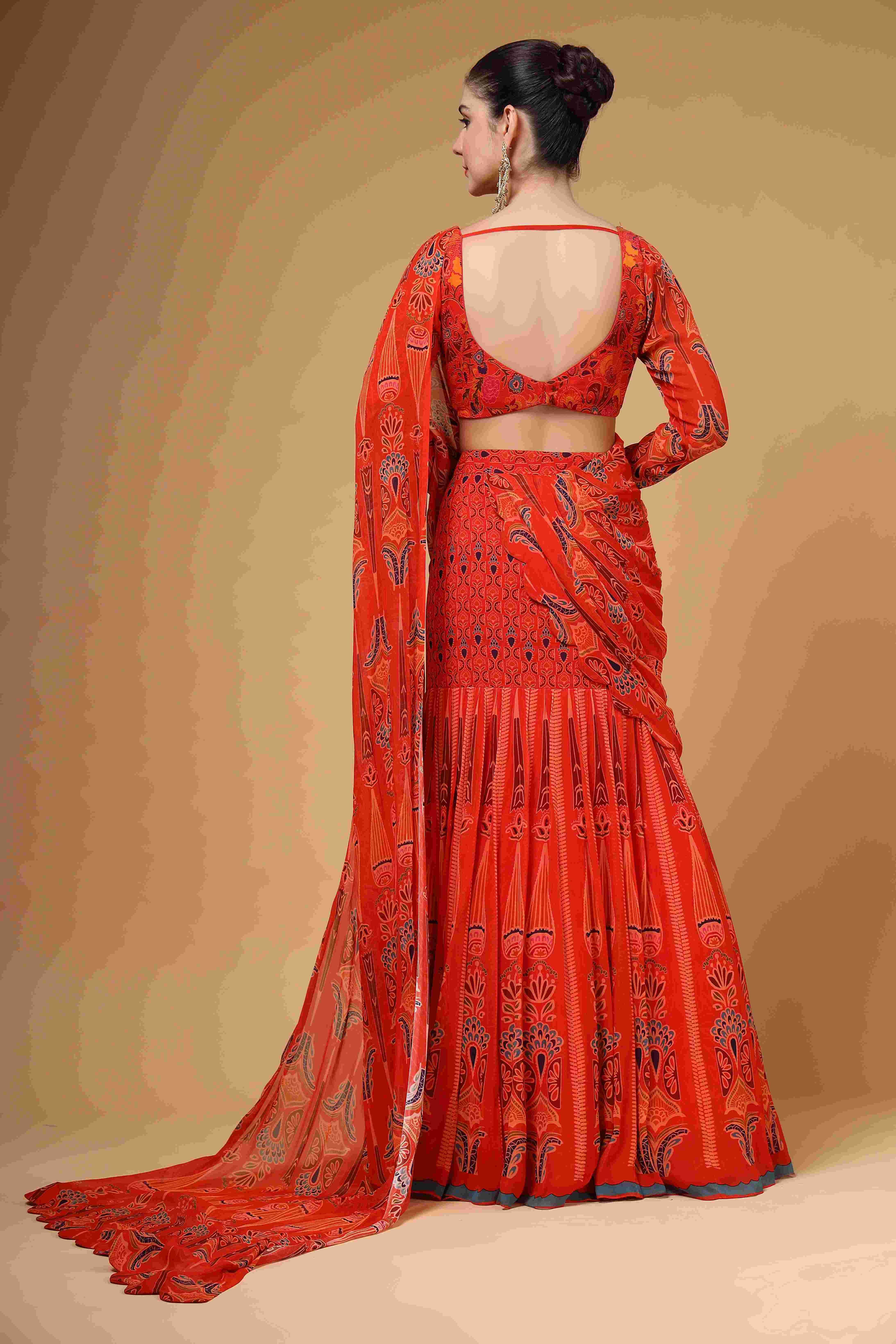 A model showcasing Amvya Red Fish Cut Drape Saree by Miku Kumar from Miku Kumar's collection
