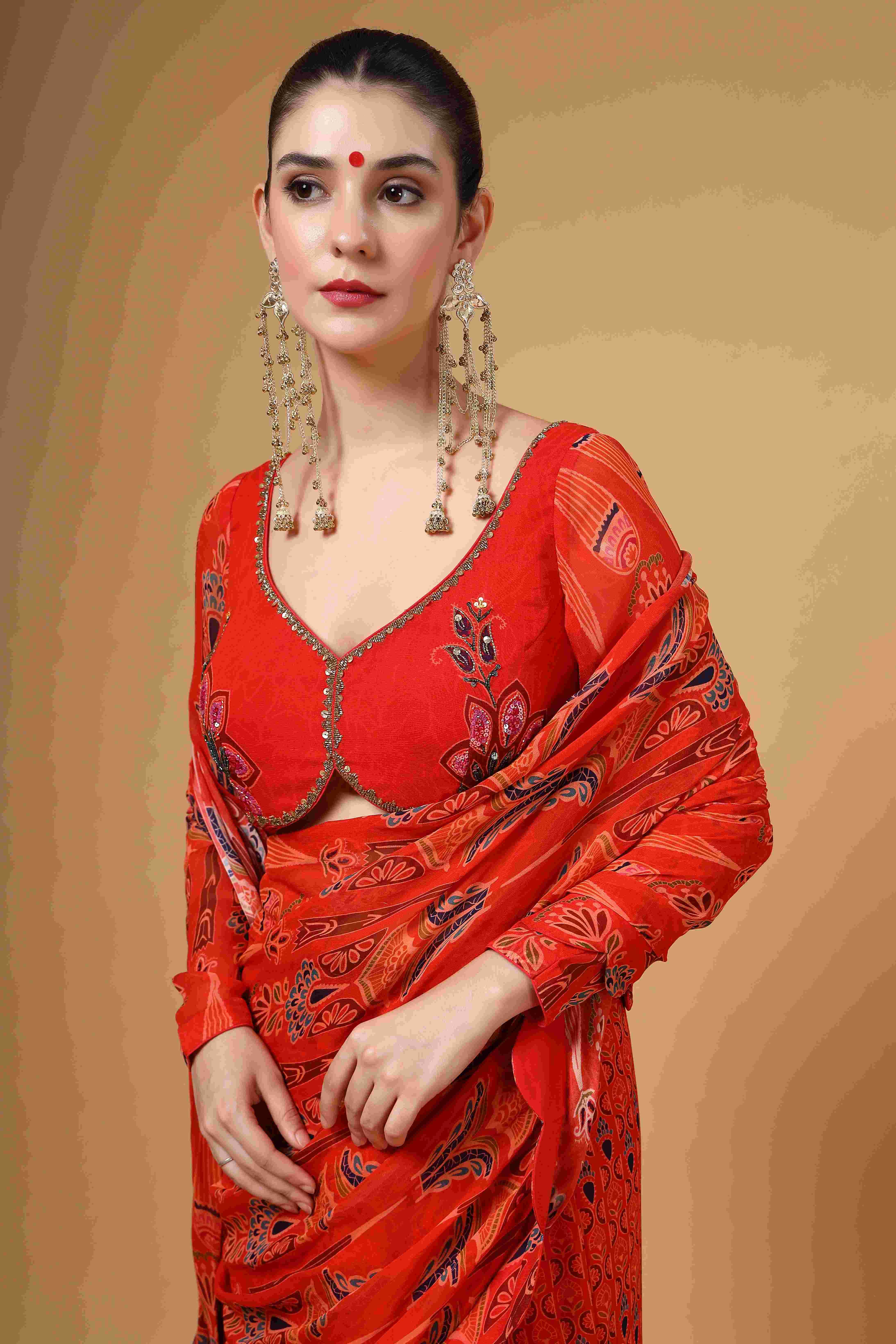 A model showcasing Amvya Red Fish Cut Drape Saree by Miku Kumar from Miku Kumar's collection