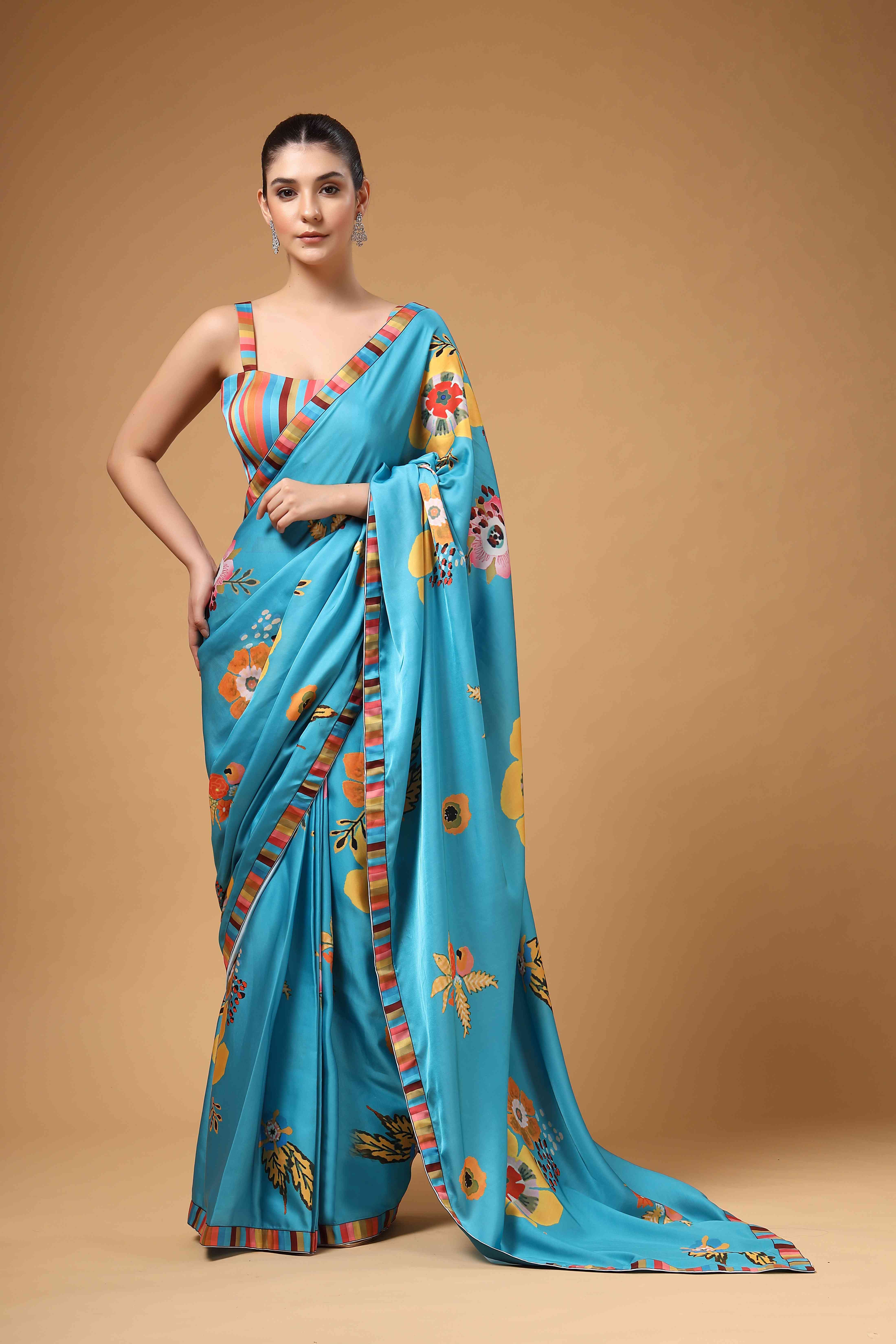 A model showcasing Tivra Teal Floral Print Drape Saree Feature image by Miku Kumar from Miku Kumar's collection