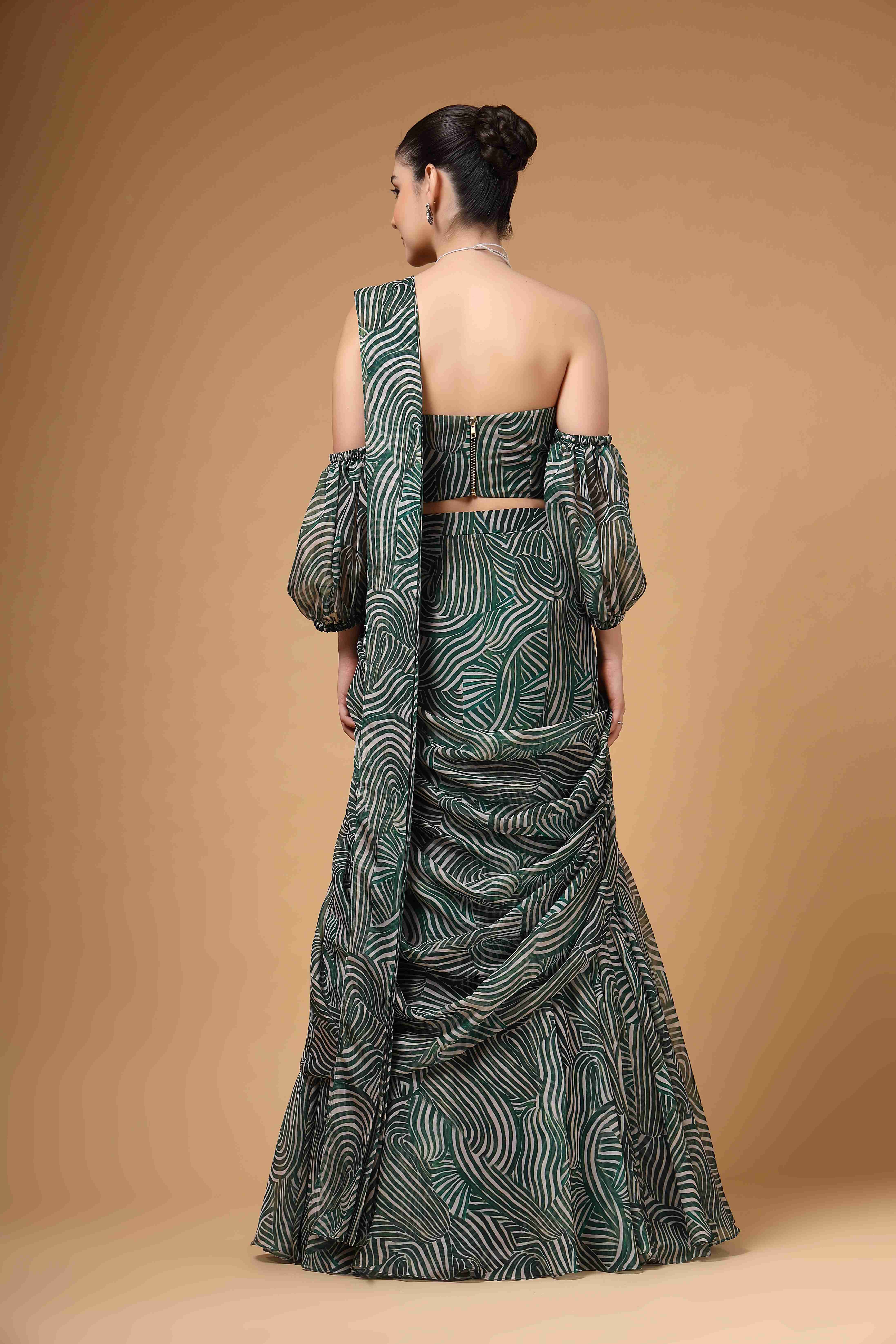 A model showcasing Evara Green Drape Saree by Miku Kumar from Miku Kumar's collection