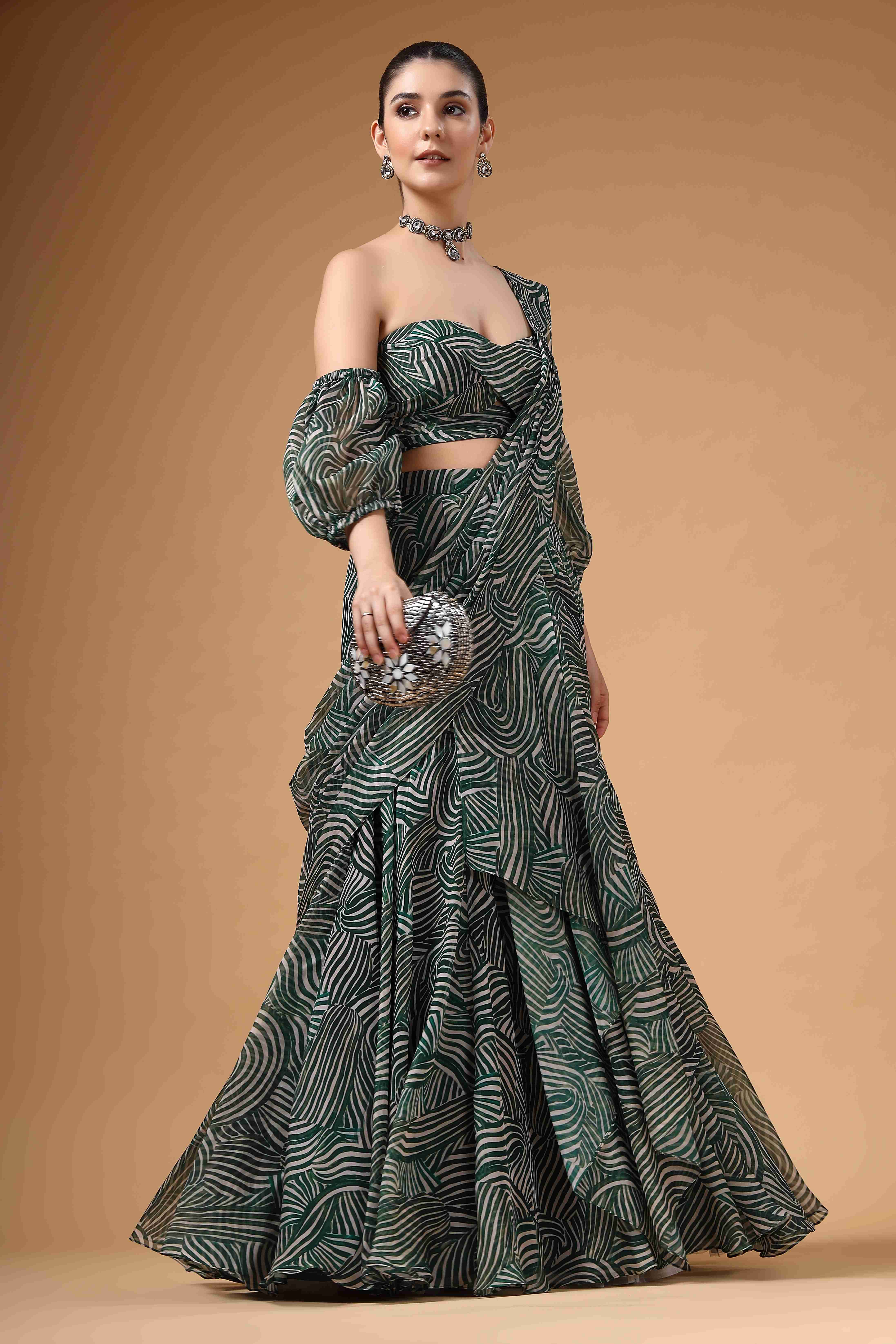 A model showcasing Evara Green Drape Saree by Miku Kumar from Miku Kumar's collection