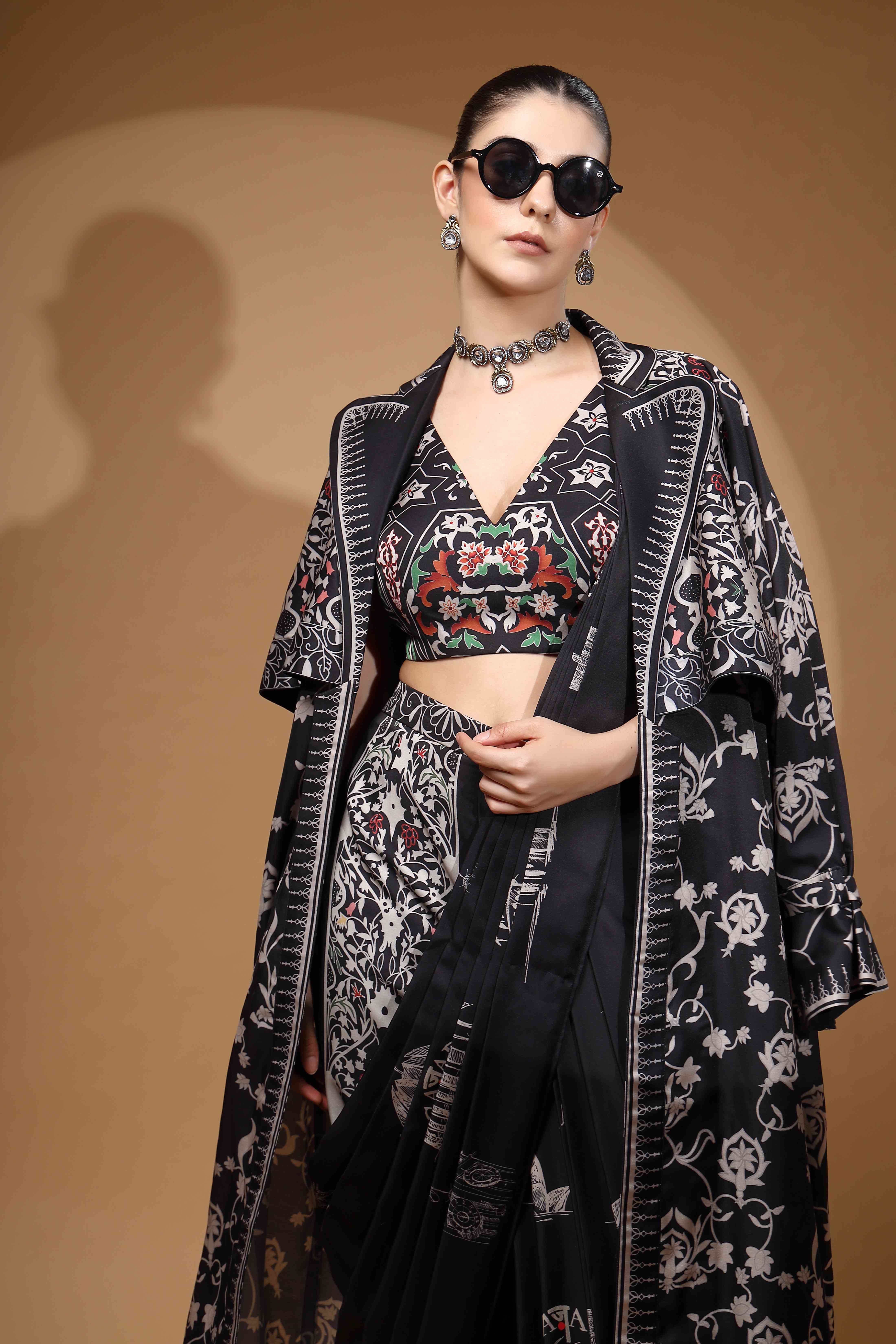 A model showcasing Nyrah Black Pant Drape Saree by Miku Kumar from Miku Kumar's collection