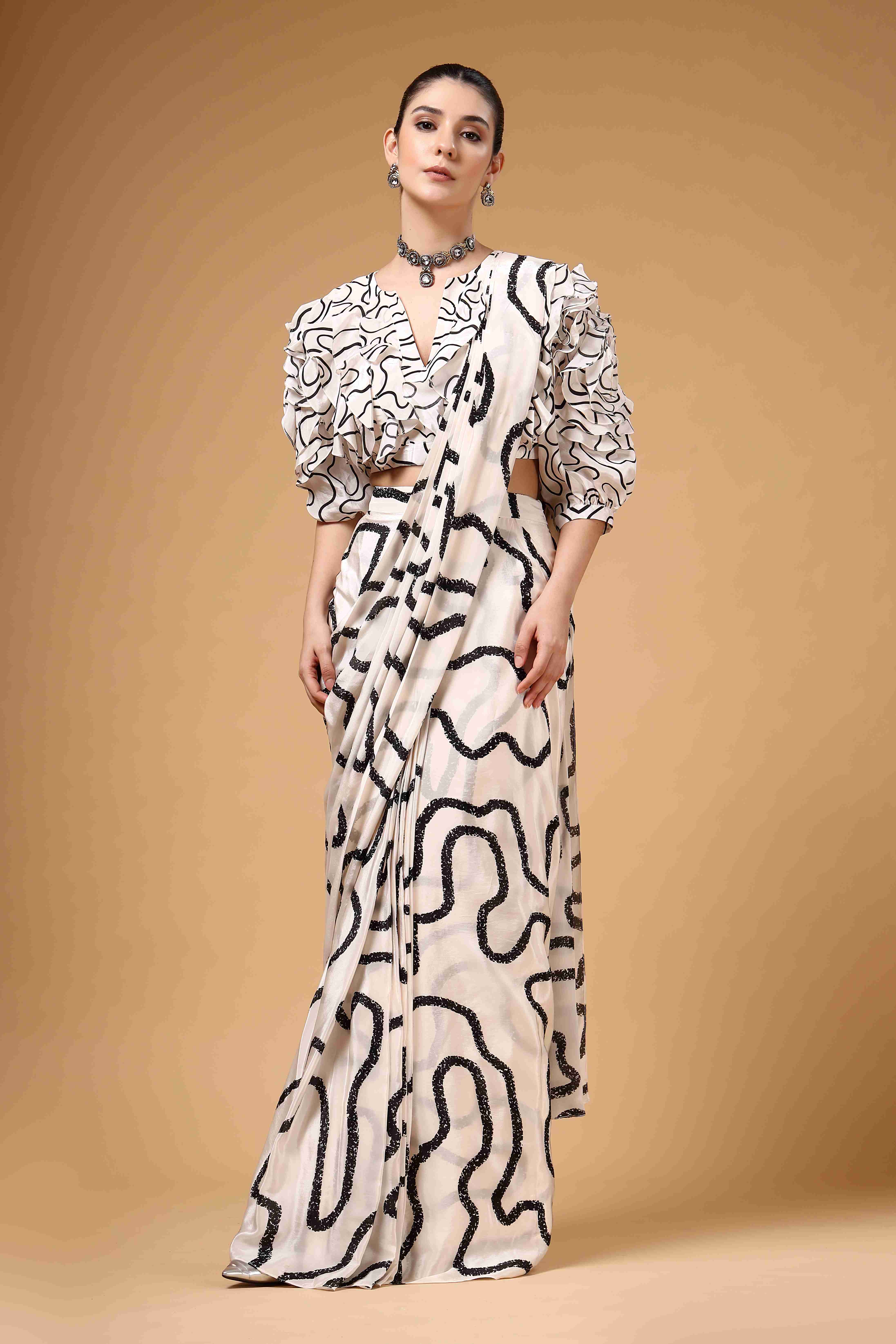A model showcasing Lumea Ivory And Black Drape Saree Feature image by Miku Kumar from Miku Kumar's collection