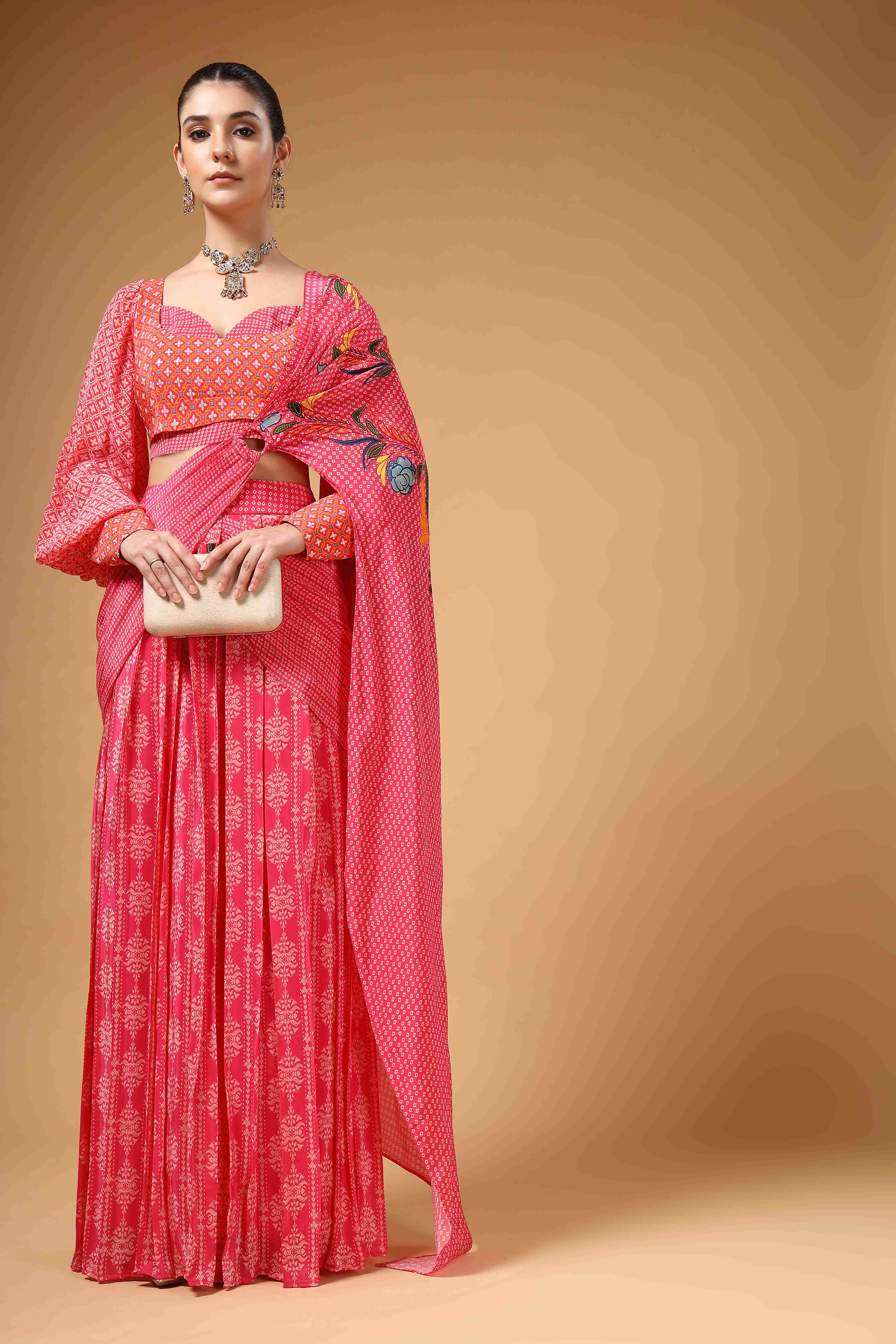 A model showcasing Velura Pink Drape Saree by Miku Kumar from Miku Kumar's collection