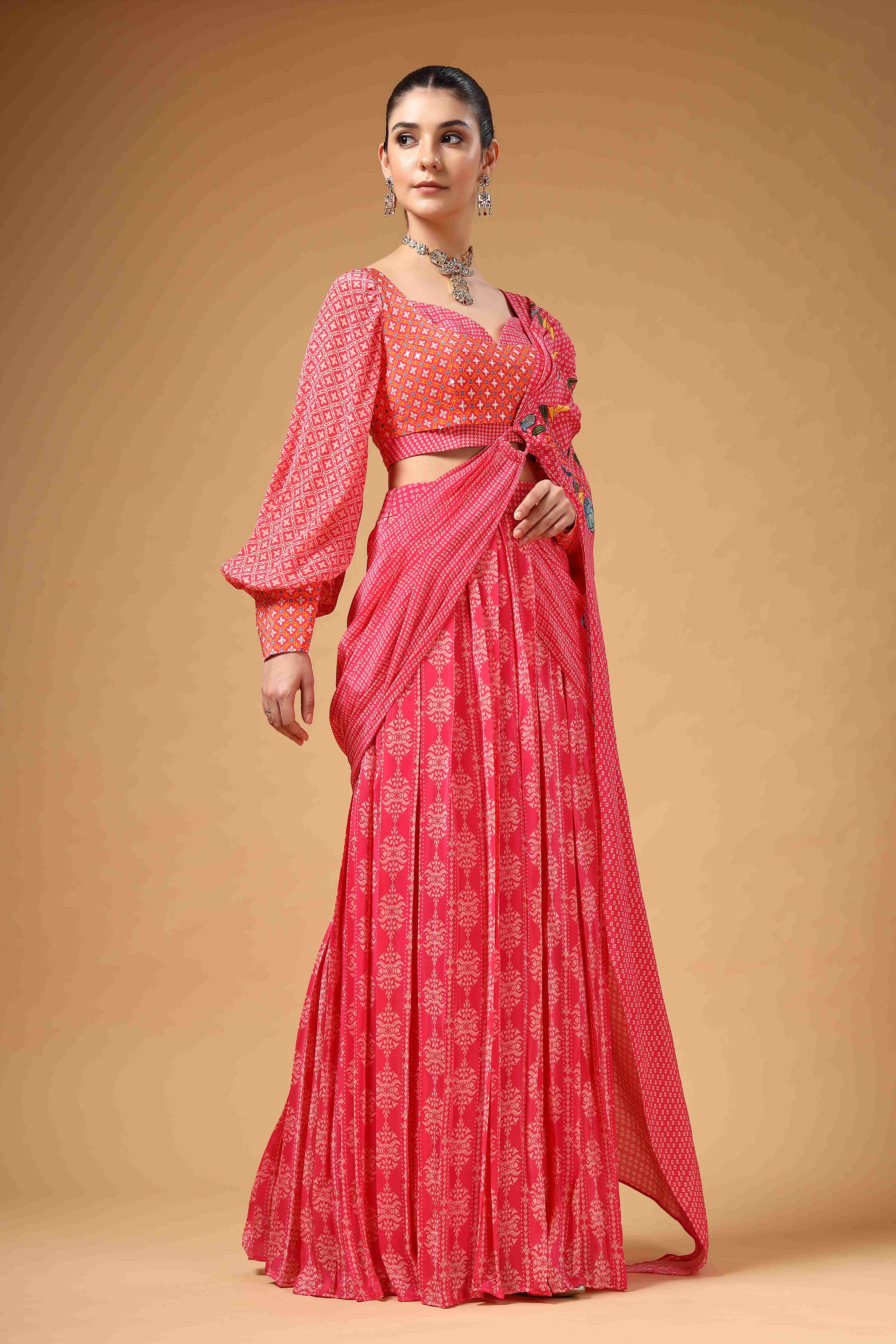 A model showcasing Velura Pink Drape Saree by Miku Kumar from Miku Kumar's collection