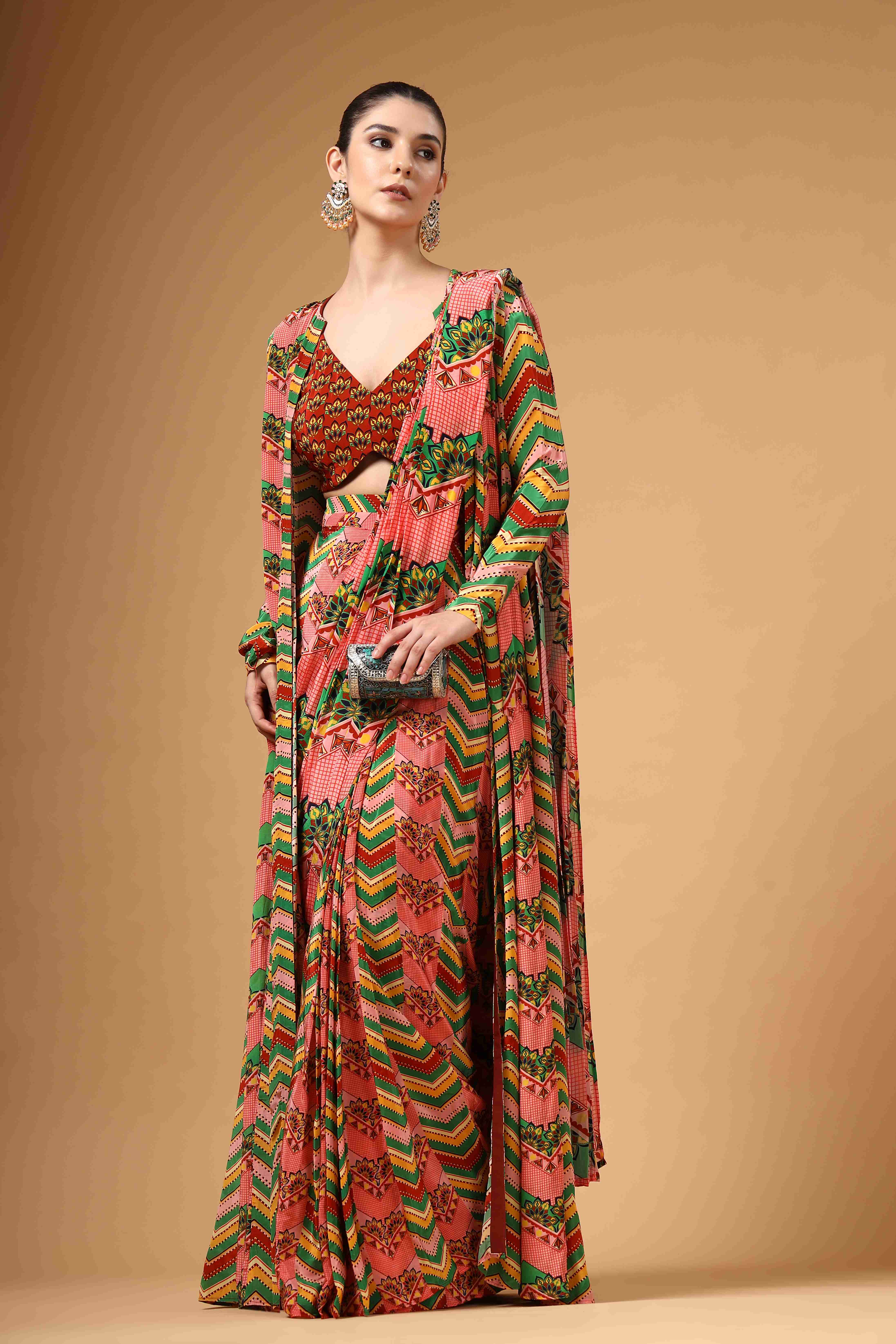 A model showcasing Zyona Multi Colour Cape Drape Saree by Miku Kumar from Miku Kumar's collection