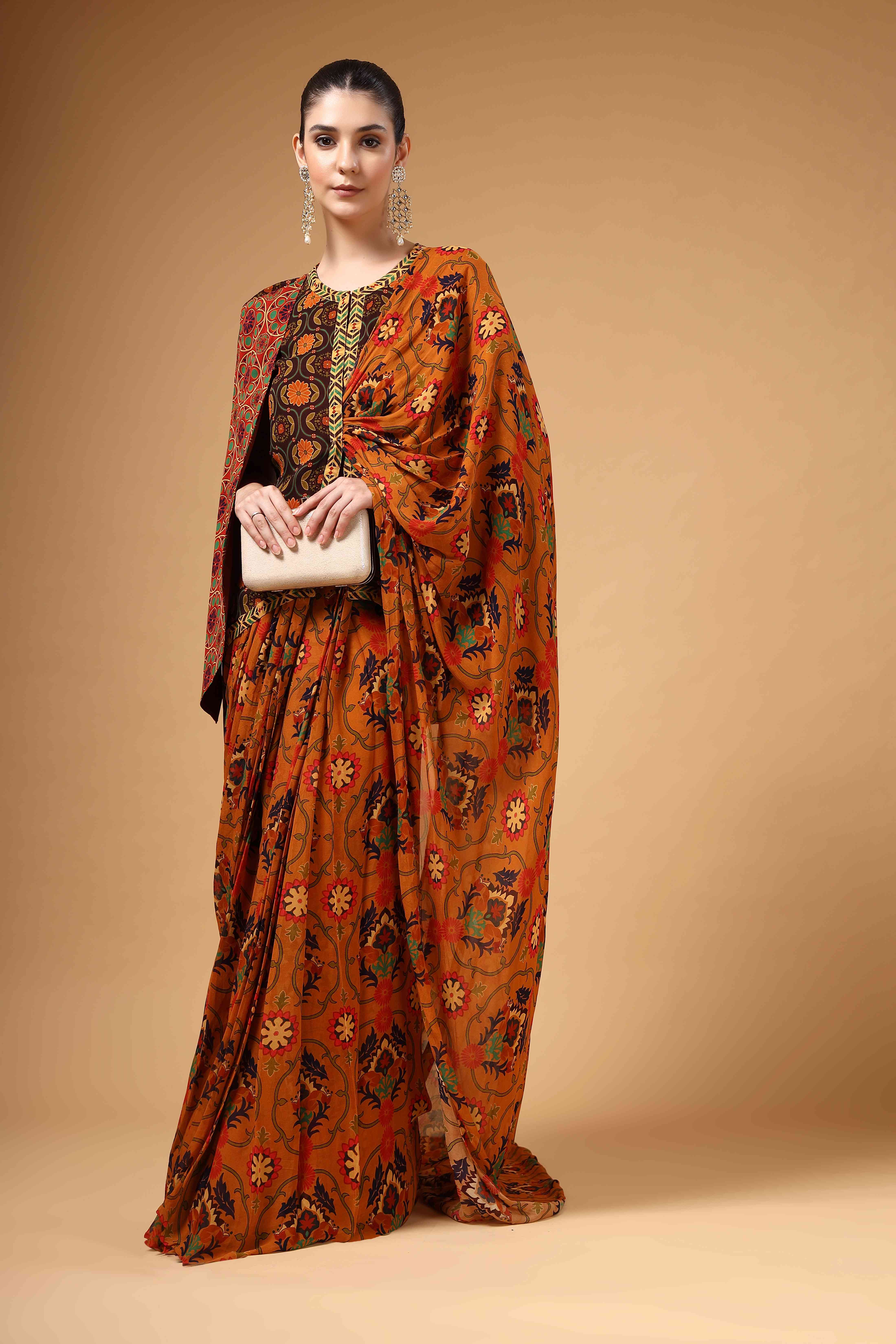 A model showcasing Ravya Brown Drape Saree by Miku Kumar from Miku Kumar's collection