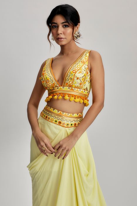 A model showcasing Yellow Ruhi Drape Skirt Set by Gopi Vaid from Gopi Vaid's collection
