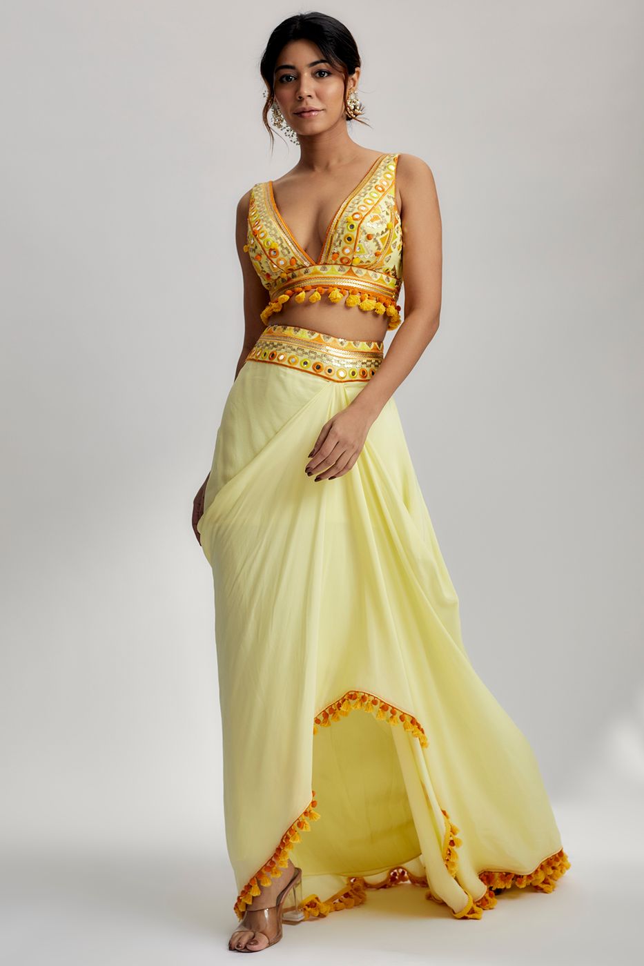 A model showcasing Yellow Ruhi Drape Skirt Set Feature image by Gopi Vaid from Gopi Vaid's collection