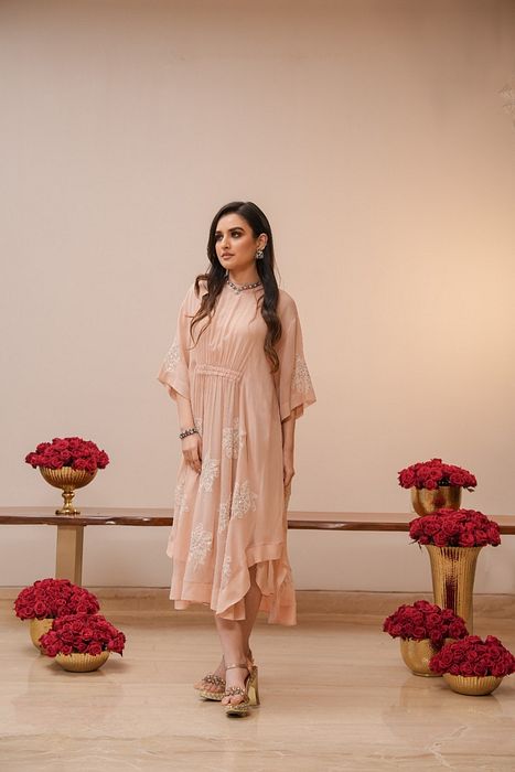 A model showcasing Light Pink Chikan Dress by Myra By Anju Narian from Myra By Anju Narian's collection A model showcasing Light Pink Chikan Dress by Myra By Anju Narian from Myra By Anju Narian's collection