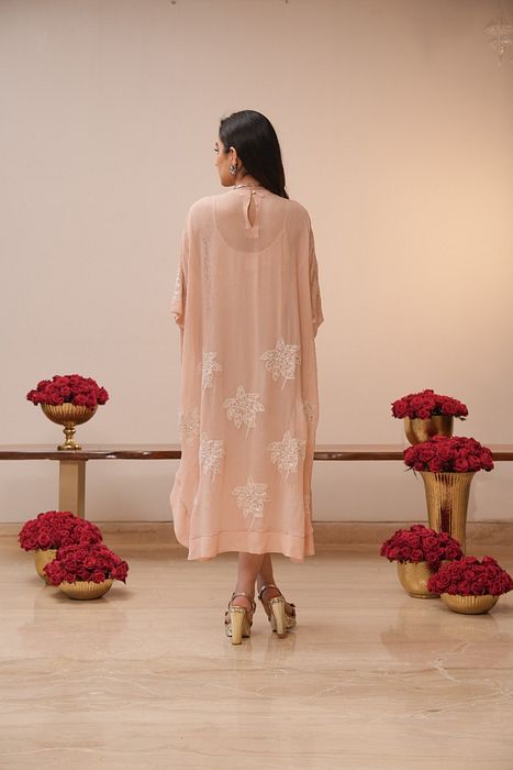 A model showcasing Light Pink Chikan Dress by Myra By Anju Narian from Myra By Anju Narian's collection A model showcasing Light Pink Chikan Dress by Myra By Anju Narian from Myra By Anju Narian's collection