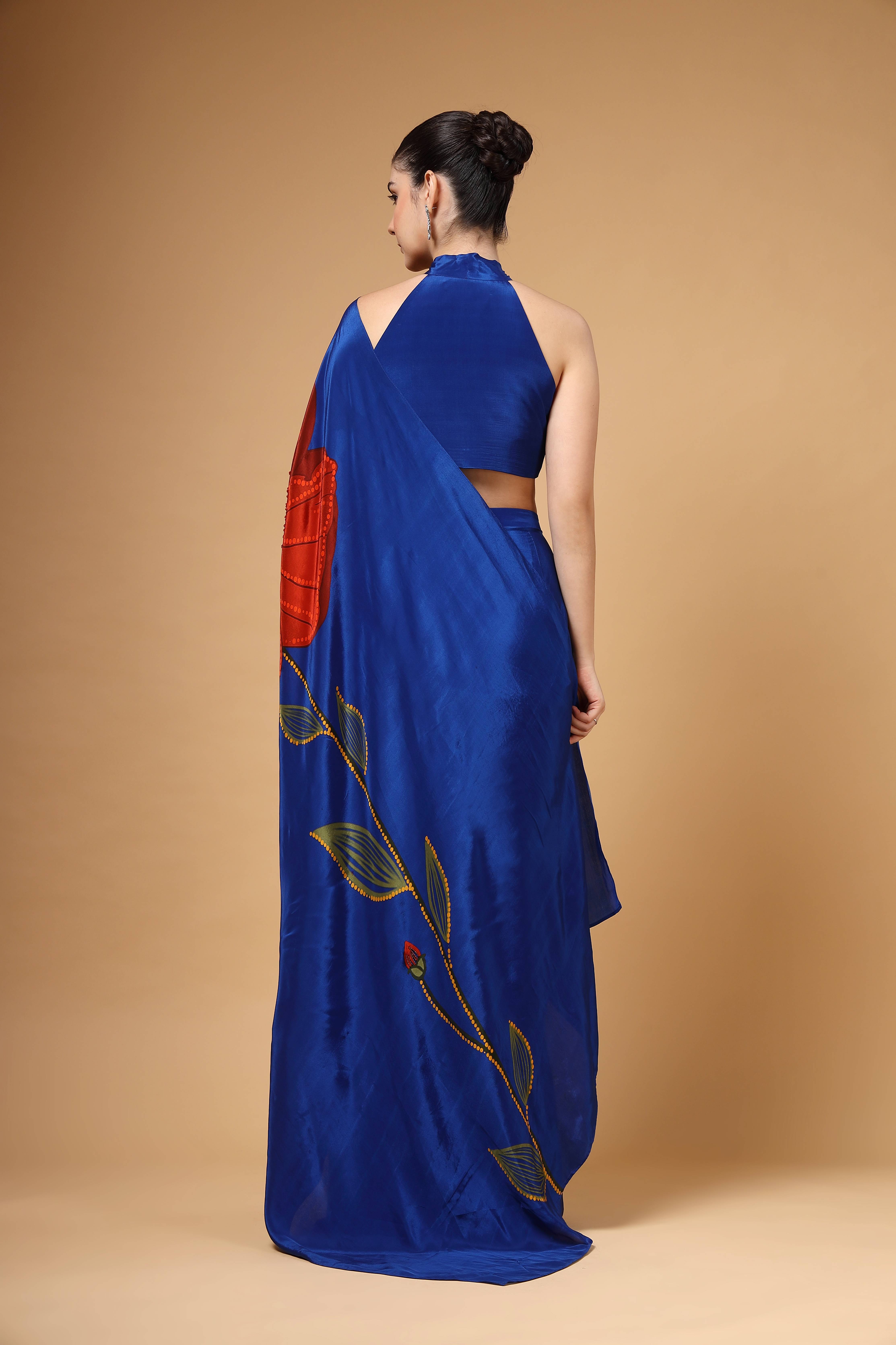 A model showcasing Auraya Royal Blue Drape Saree by Miku Kumar from Miku Kumar's collection