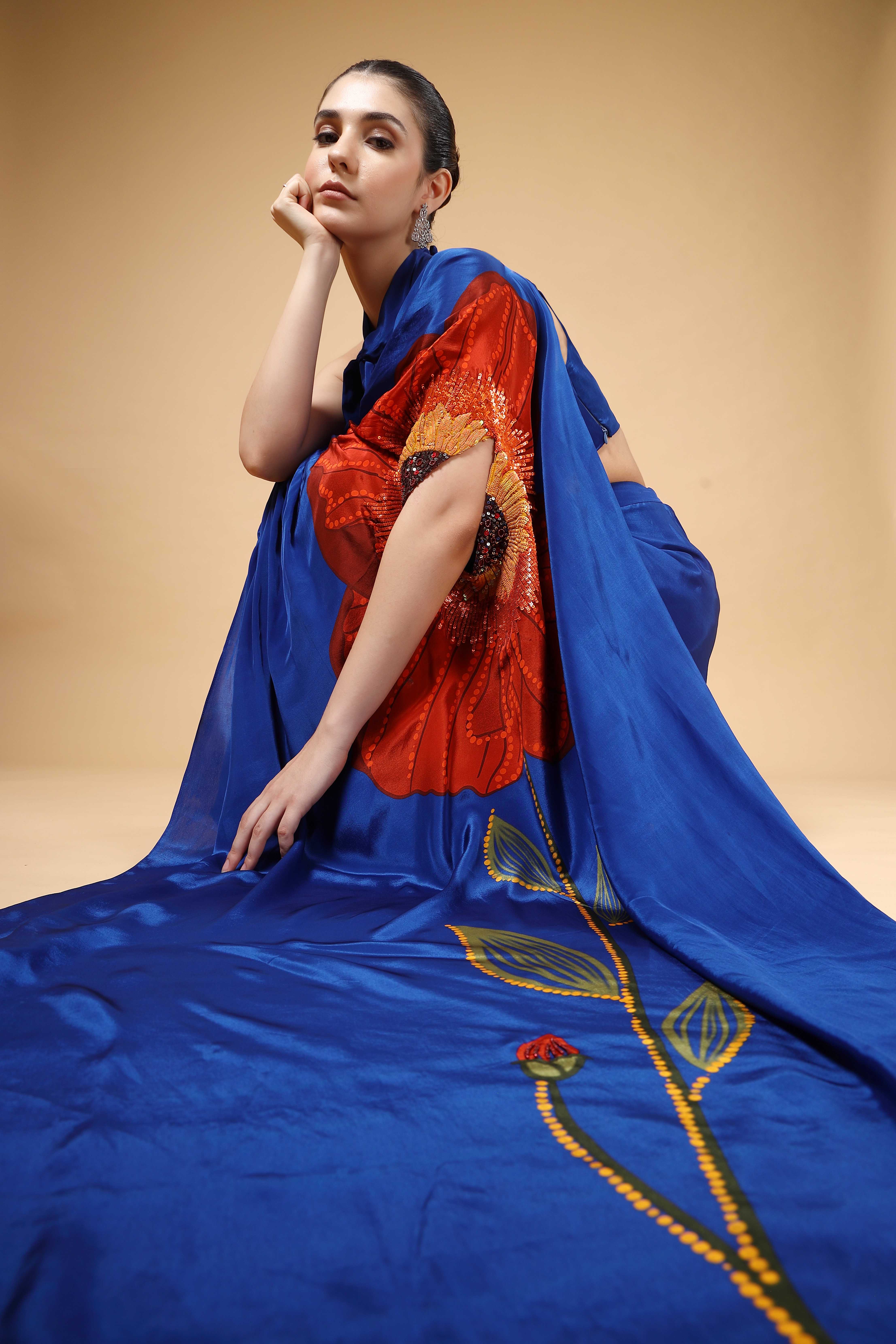 A model showcasing Auraya Royal Blue Drape Saree by Miku Kumar from Miku Kumar's collection