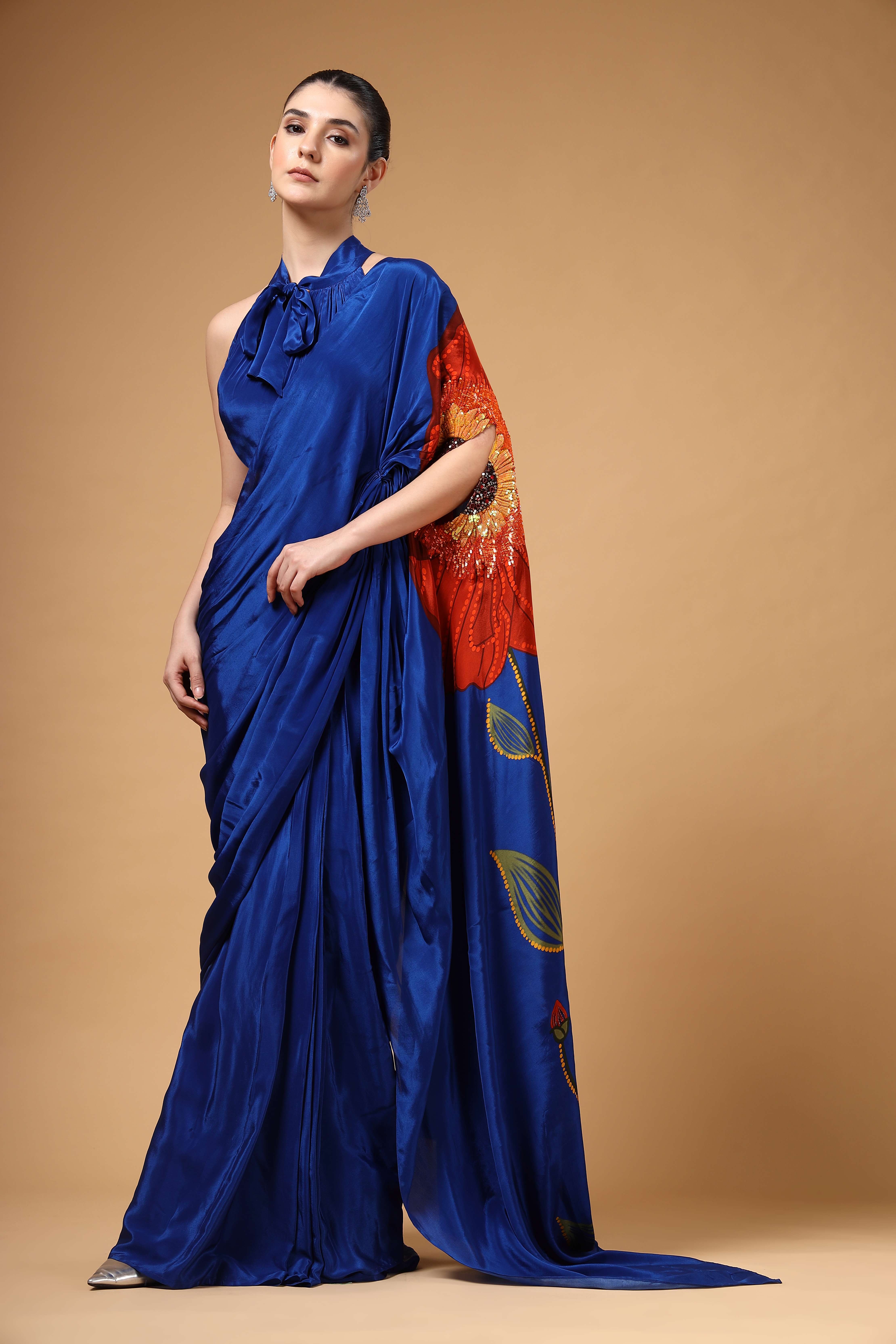 A model showcasing Auraya Royal Blue Drape Saree by Miku Kumar from Miku Kumar's collection