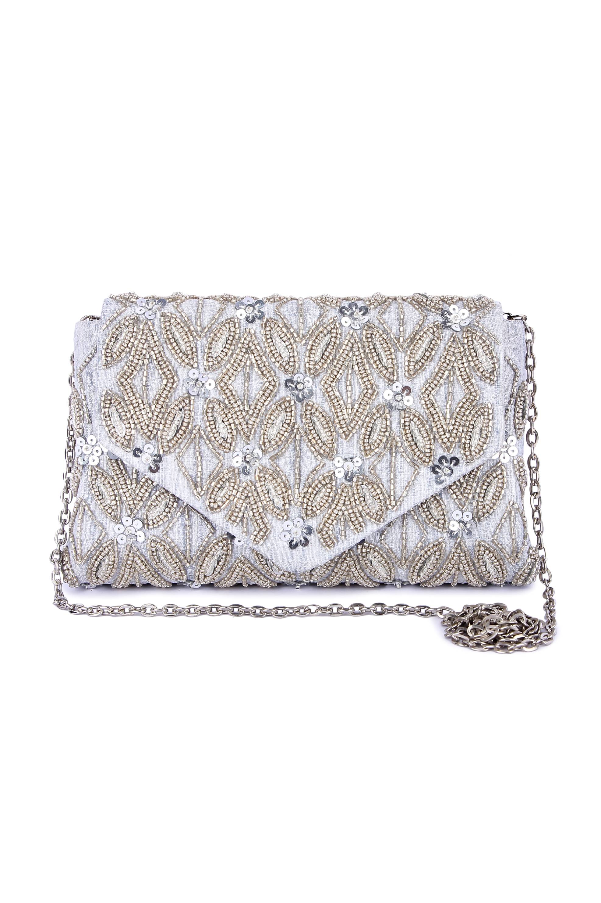 A model showcasing Silver Shyna Clutch Feature image by The Purple Sack from The Purple Sack's collection