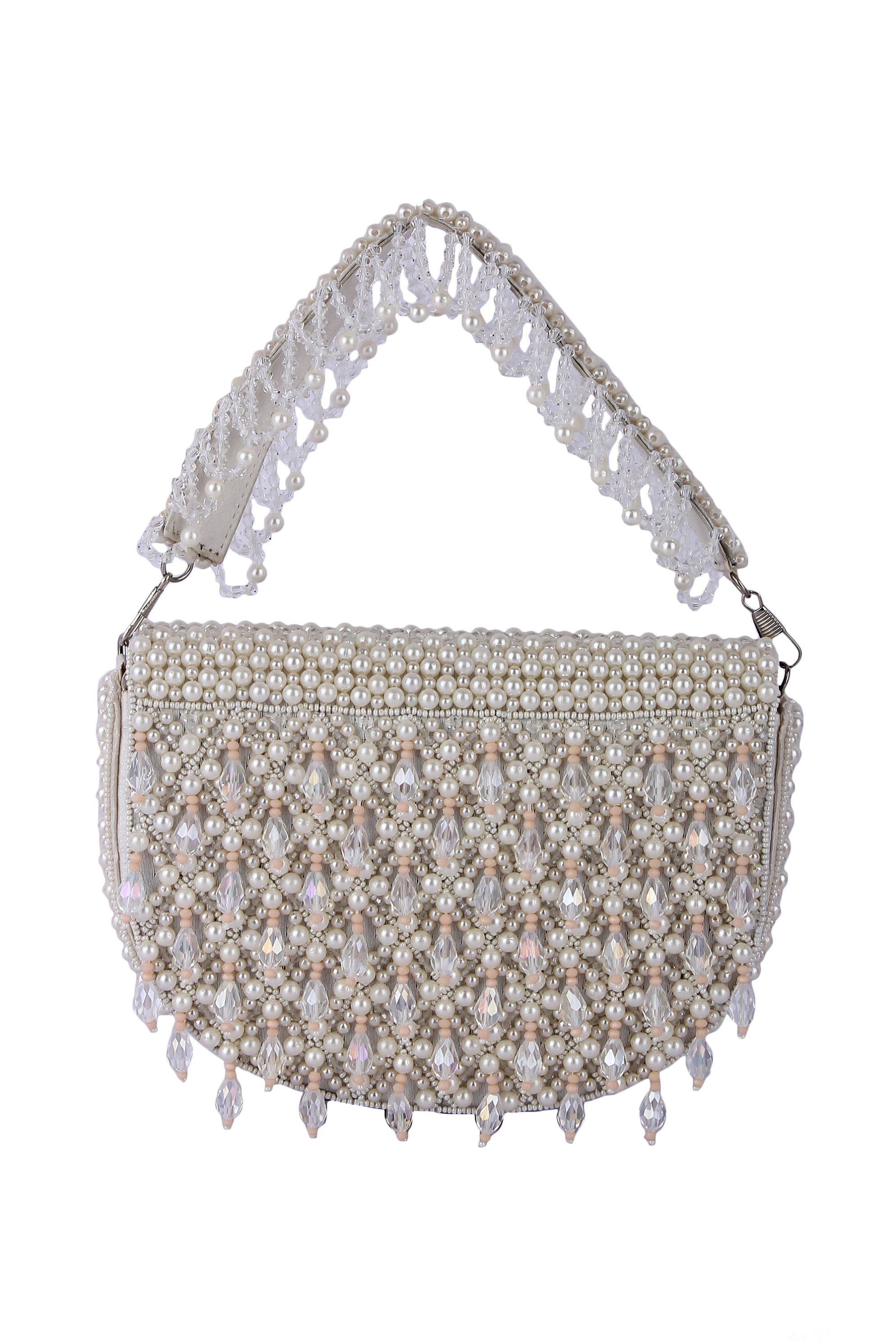 A model showcasing Rubeena White Pearl Clutch Feature image by The Purple Sack from The Purple Sack's collection