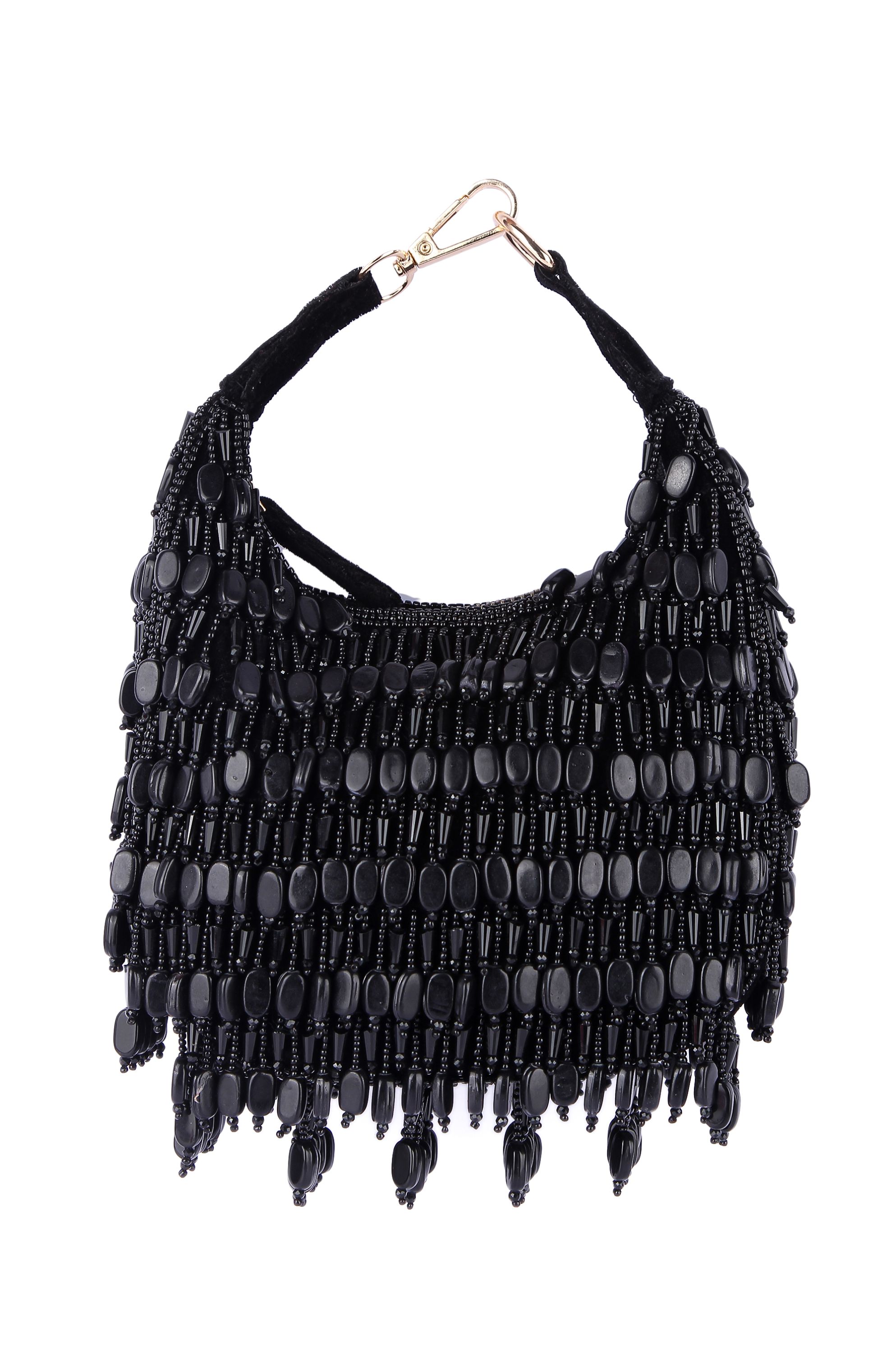 A model showcasing Dhimmar Black Clutch by The Purple Sack from The Purple Sack's collection