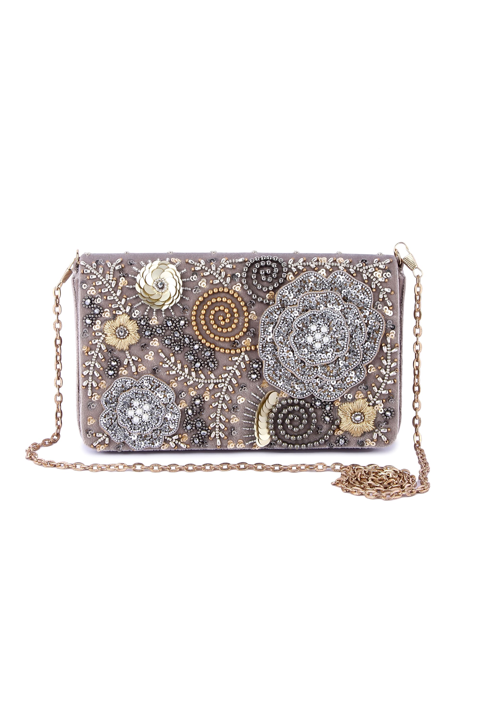 A model showcasing Foolwati Clutch by The Purple Sack from The Purple Sack's collection