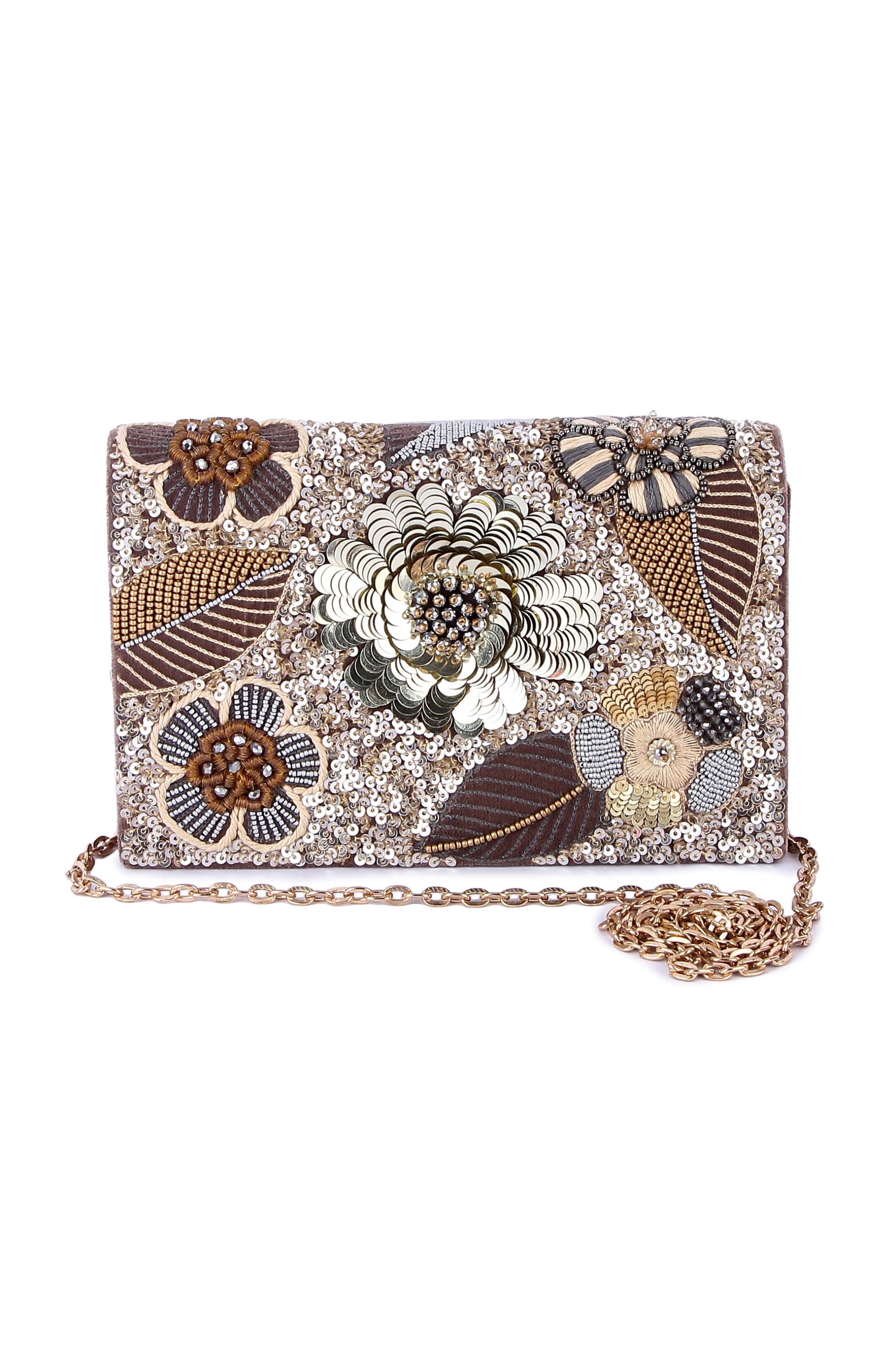 A model showcasing Deyani Clutch by The Purple Sack from The Purple Sack's collection