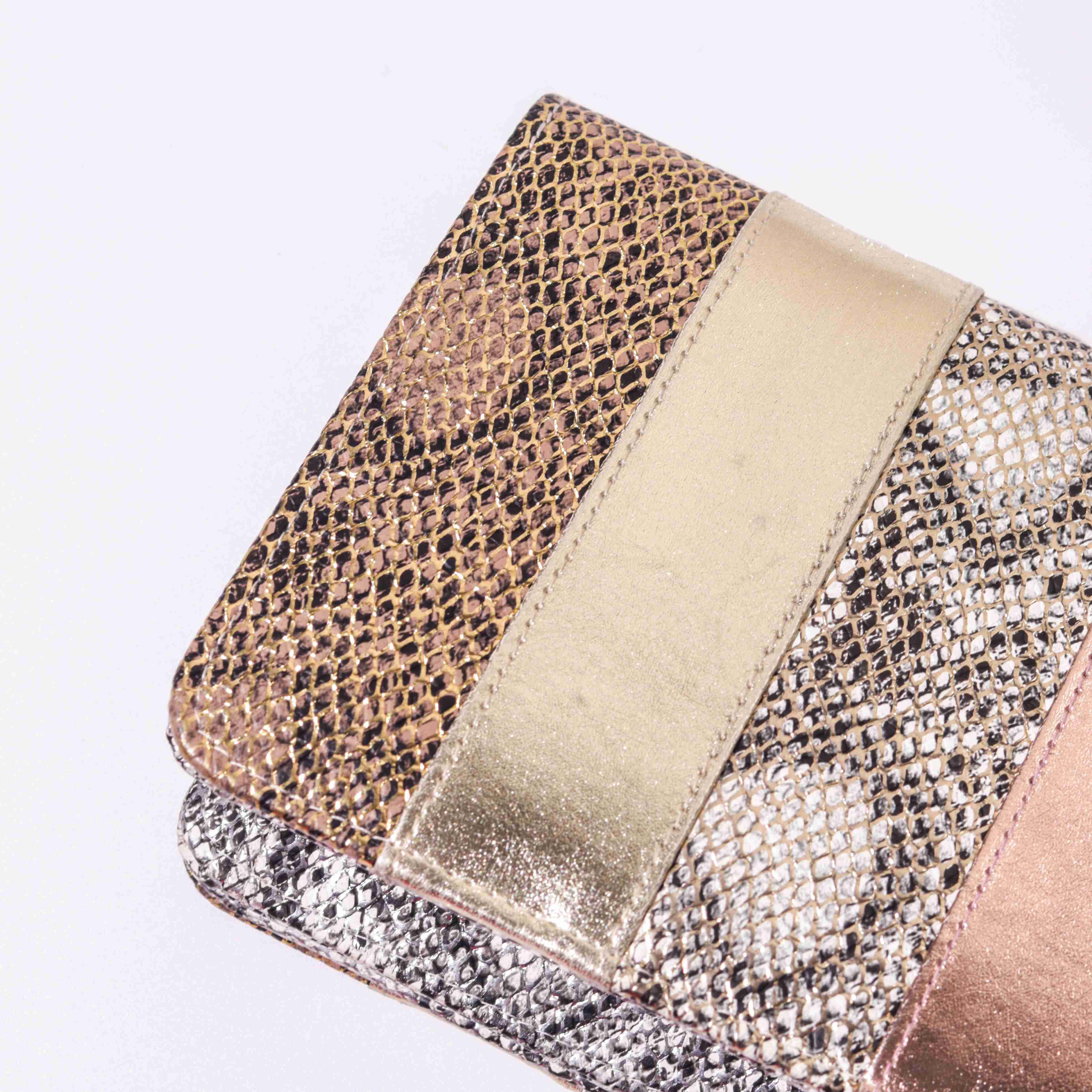 A model showcasing All In Me Clutch by The Purple Sack from The Purple Sack's collection