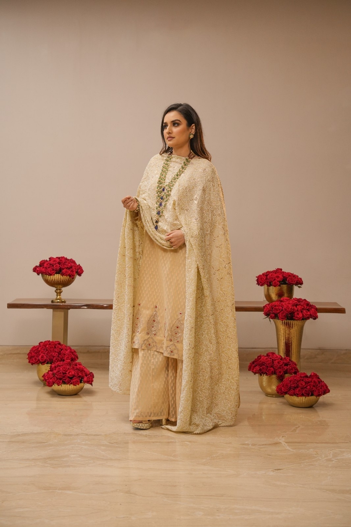 A model showcasing Ecru Sharara Set With Heavy Chikankari Dupatta Feature image by Myra By Anju Narian from Myra By Anju Narian's collection