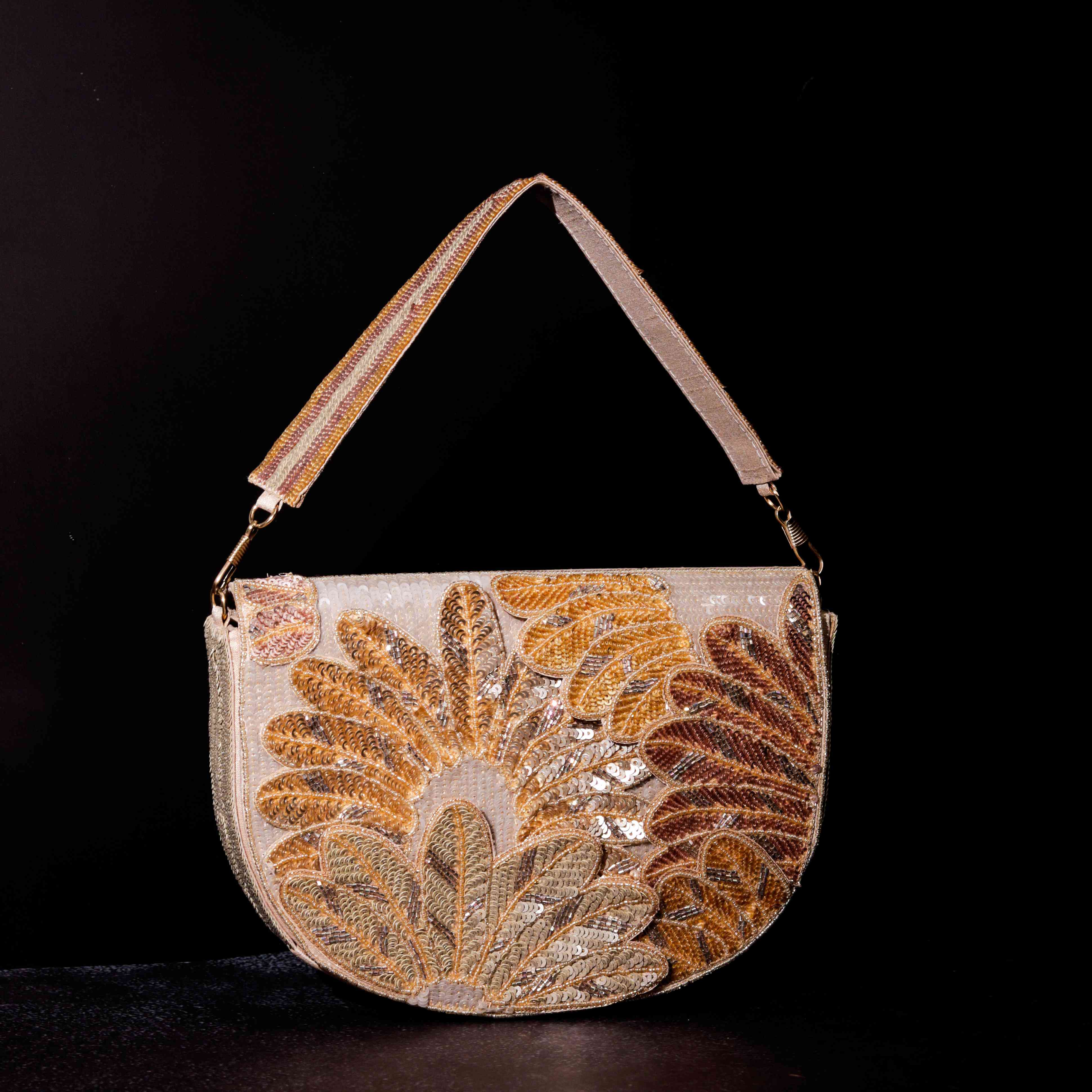 A model showcasing Golden Fawn Clutch by The Purple Sack from The Purple Sack's collection